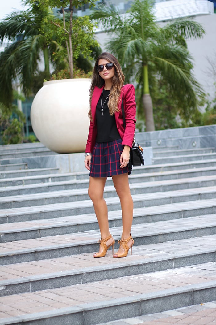 Red blazer and black shorts