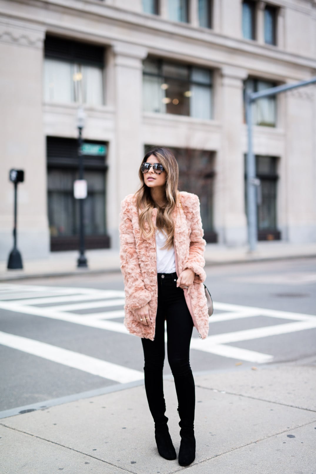 Pam Hetlinger wearing a Forever 21 Faux Fur Jacket, 7 for all Mankind black skinny jeans, delman boots, Chloé Drew Bag and Prada aviators