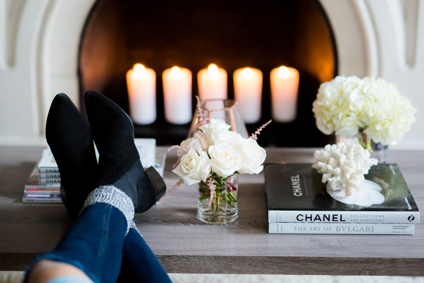 The Girl From Panama Home, Fireplace, Candles, Black Booties, Chanel table book, flowers