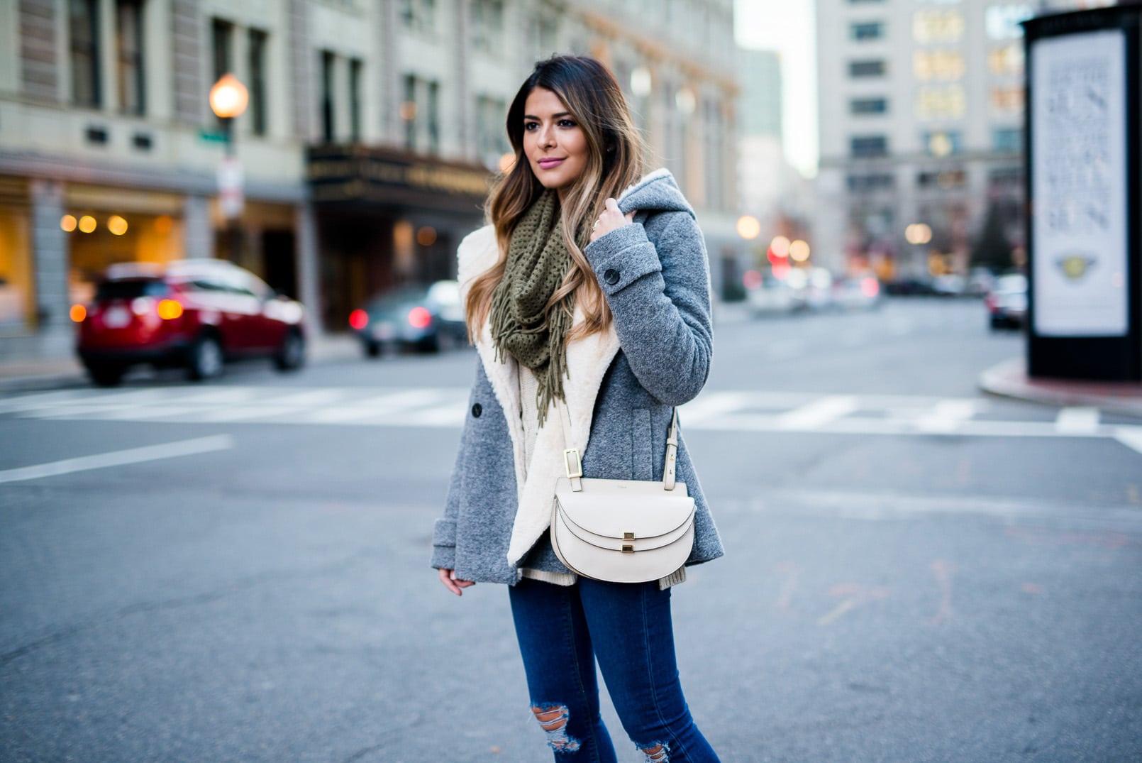 Pam Hetlinger wearing a bp fringe scarf, chloe georgia bag, asos ripped jeans, zara shearling jacket, nordstrom sweater and christian louboutin pumps. How to wear heels casually.