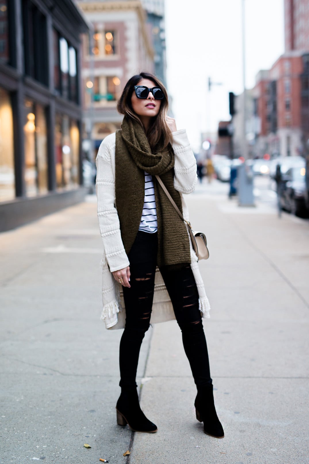 Pam Hetlinger wearing a Mango Striped Tee, Mango Black Booties, DSTLD Black Ripped Jeans, Mango Fringe Cardigan and a Forever 21 Khaki Scarf