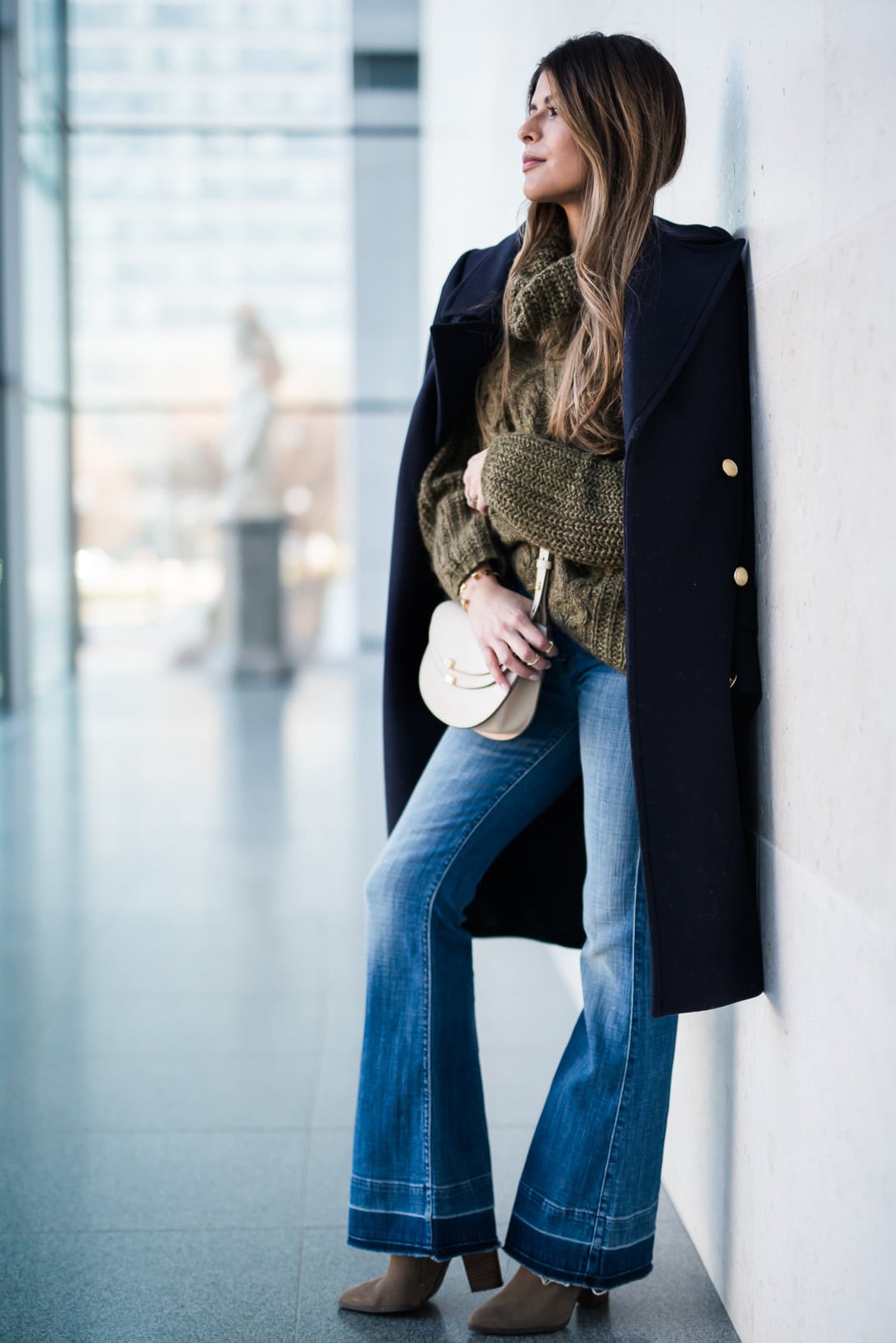 Pam Hetlinger, The Girl From Panama wearing a Khaki sweater, h&m navy coat, 7 for all mankind ginger jeans, gray booties, and chloe georgia bag.