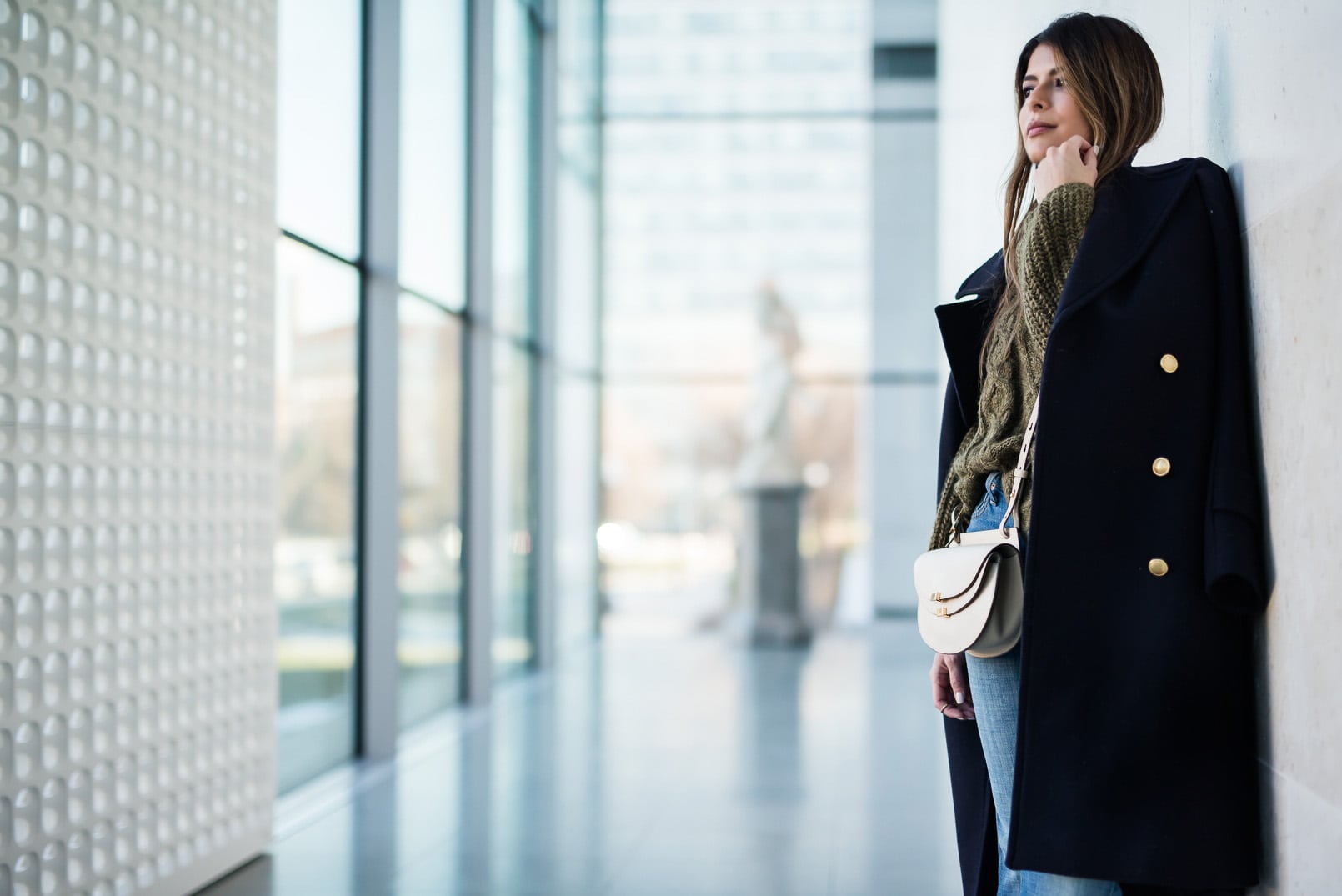 Pam Hetlinger, The Girl From Panama wearing a Khaki sweater, h&m navy coat, 7 for all mankind ginger jeans, gray booties, and chloe georgia bag.