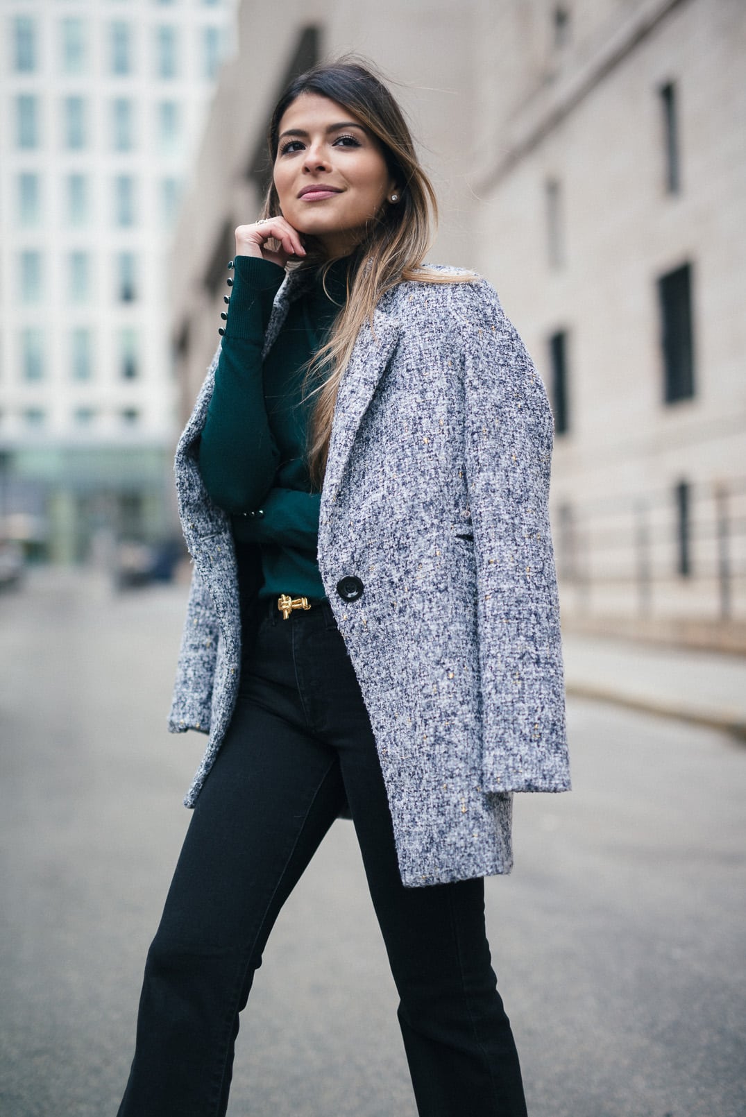 Pam Hetlinger, The Girl From Panama wearing a Topshop Funnel Neck Long Sleeve Top, Mango Flare Jeans, and Gray Coat.