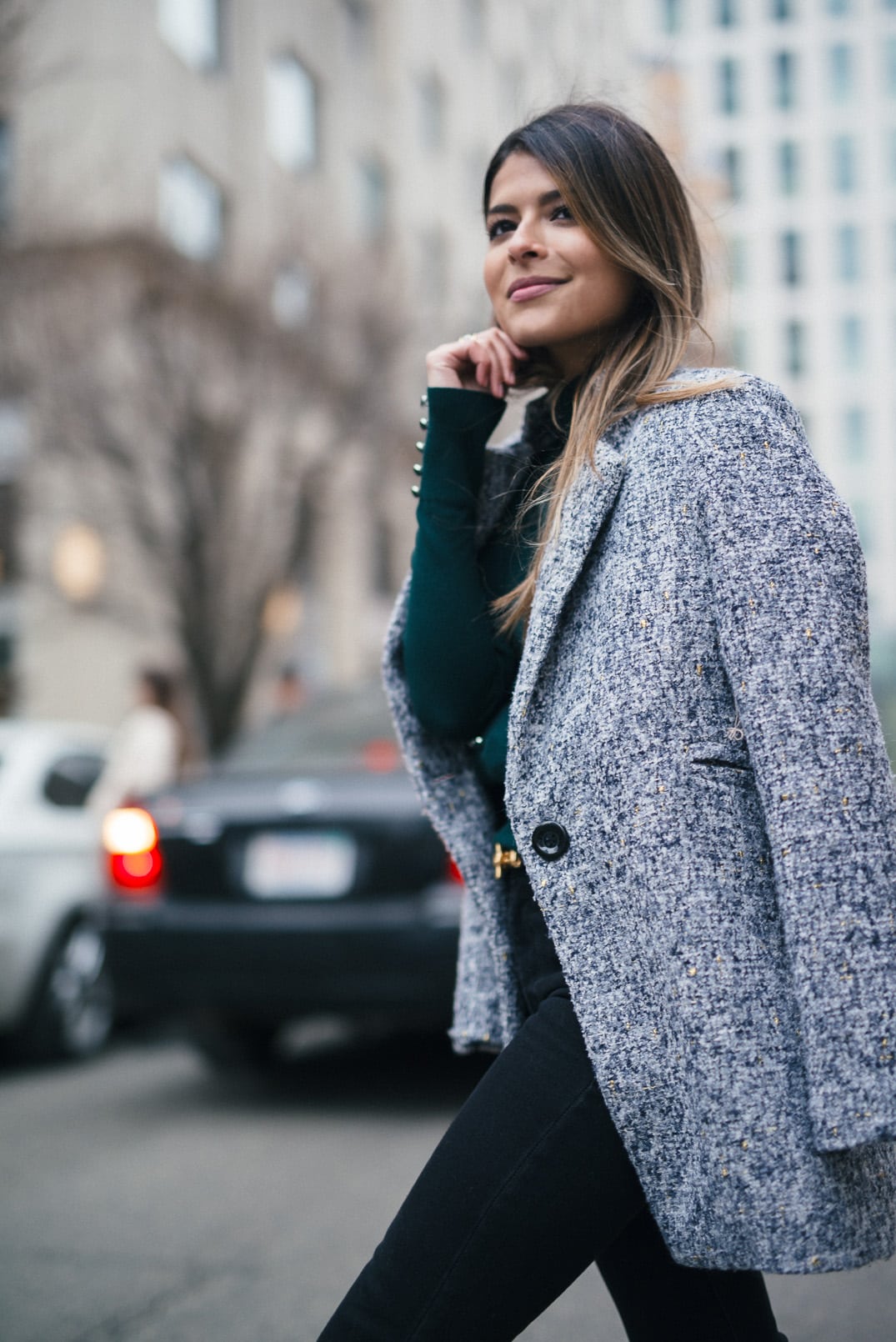 Pam Hetlinger, The Girl From Panama wearing a Topshop Funnel Neck Long Sleeve Top, Mango Flare Jeans, and Gray Coat.