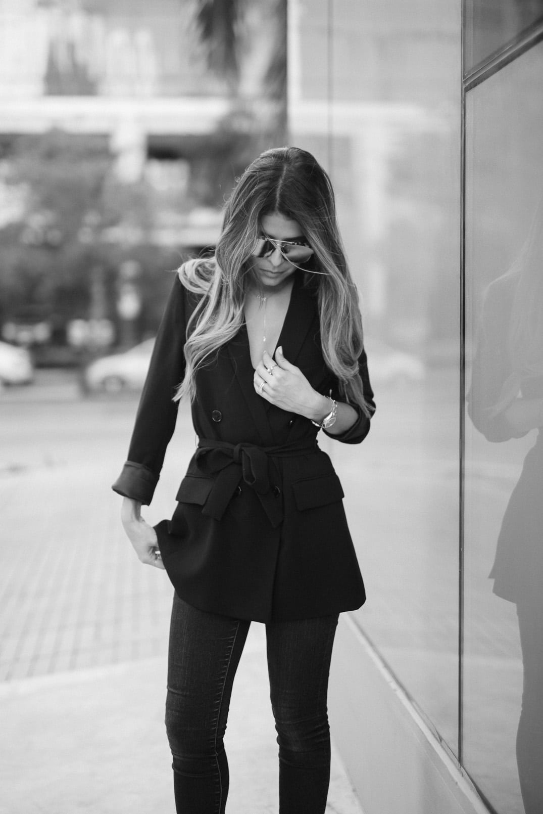 Pam Hetlinger, The Girl From Panama wearing a Zara Belted Blazer, Joe's Jeans, whistles pointed toe slide mules, and Dior Abstract Sunglasses.