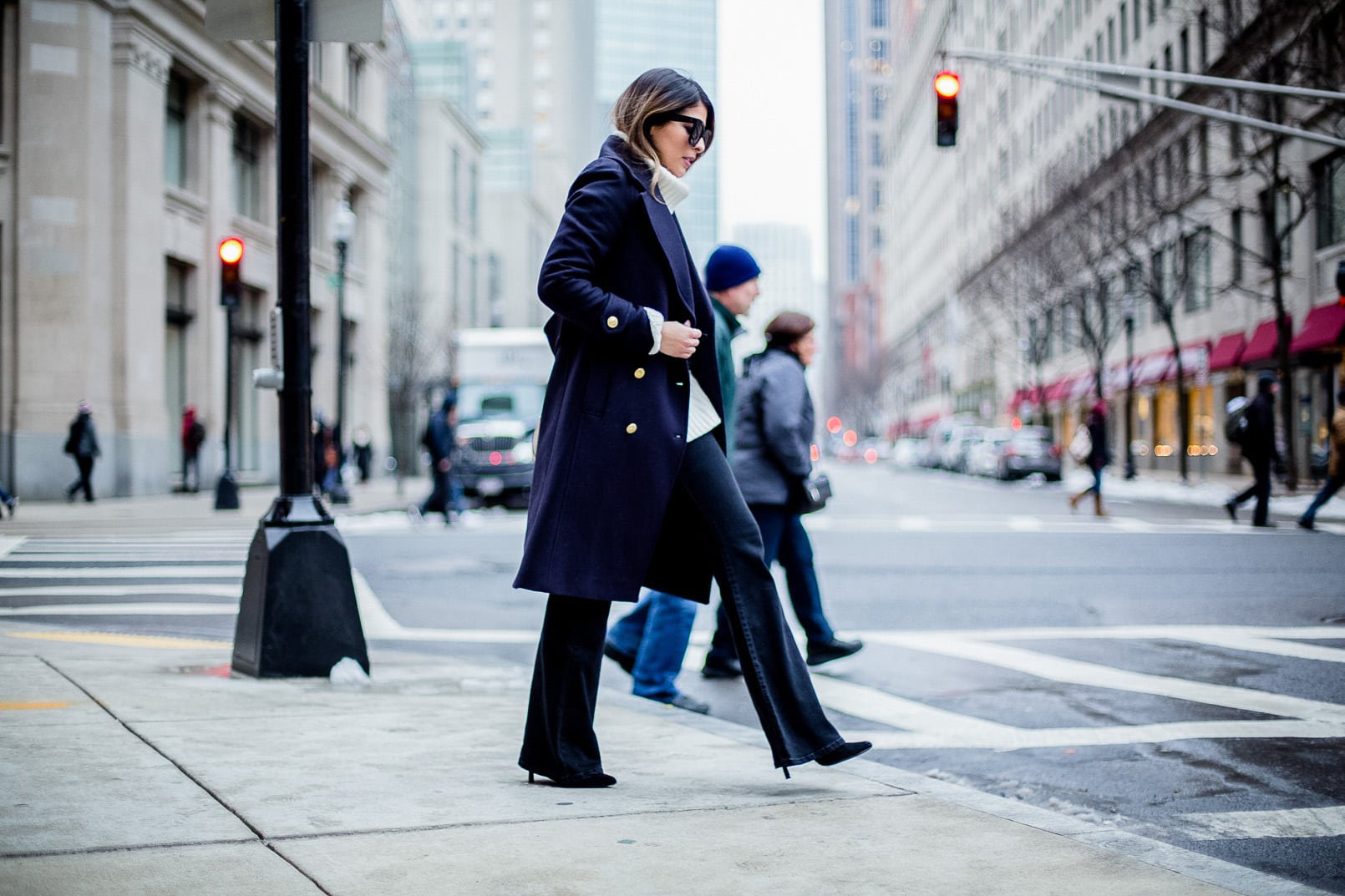 Pam Hetlinger, The Girl From Panama wearing an h&m navy coat, celine sunglasses, thin belt, mango flare jeans, white turtleneck sweater and chloe georgia bag.