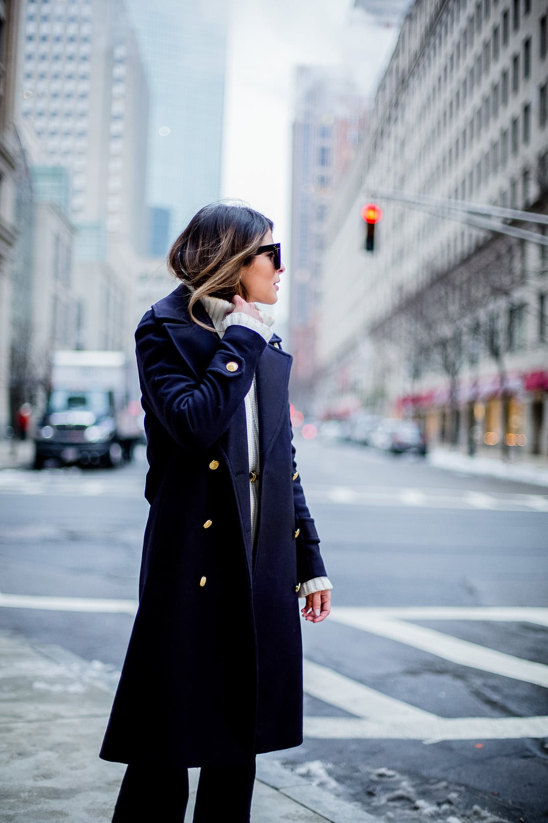 Pam Hetlinger, The Girl From Panama wearing an h&m navy coat, celine sunglasses, thin belt, mango flare jeans, white turtleneck sweater and chloe georgia bag.