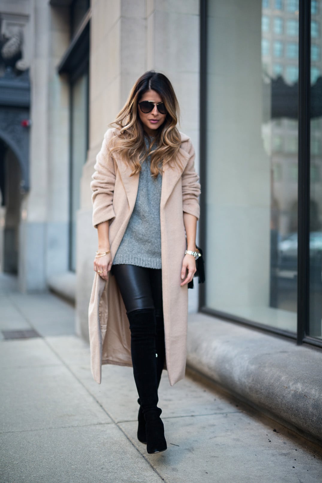 Pam Hetlinger wearing a Camel Coat, Gray Sweater, Leather Leggins, Over the Knee Boots, Winter Outfit Inspiration.
