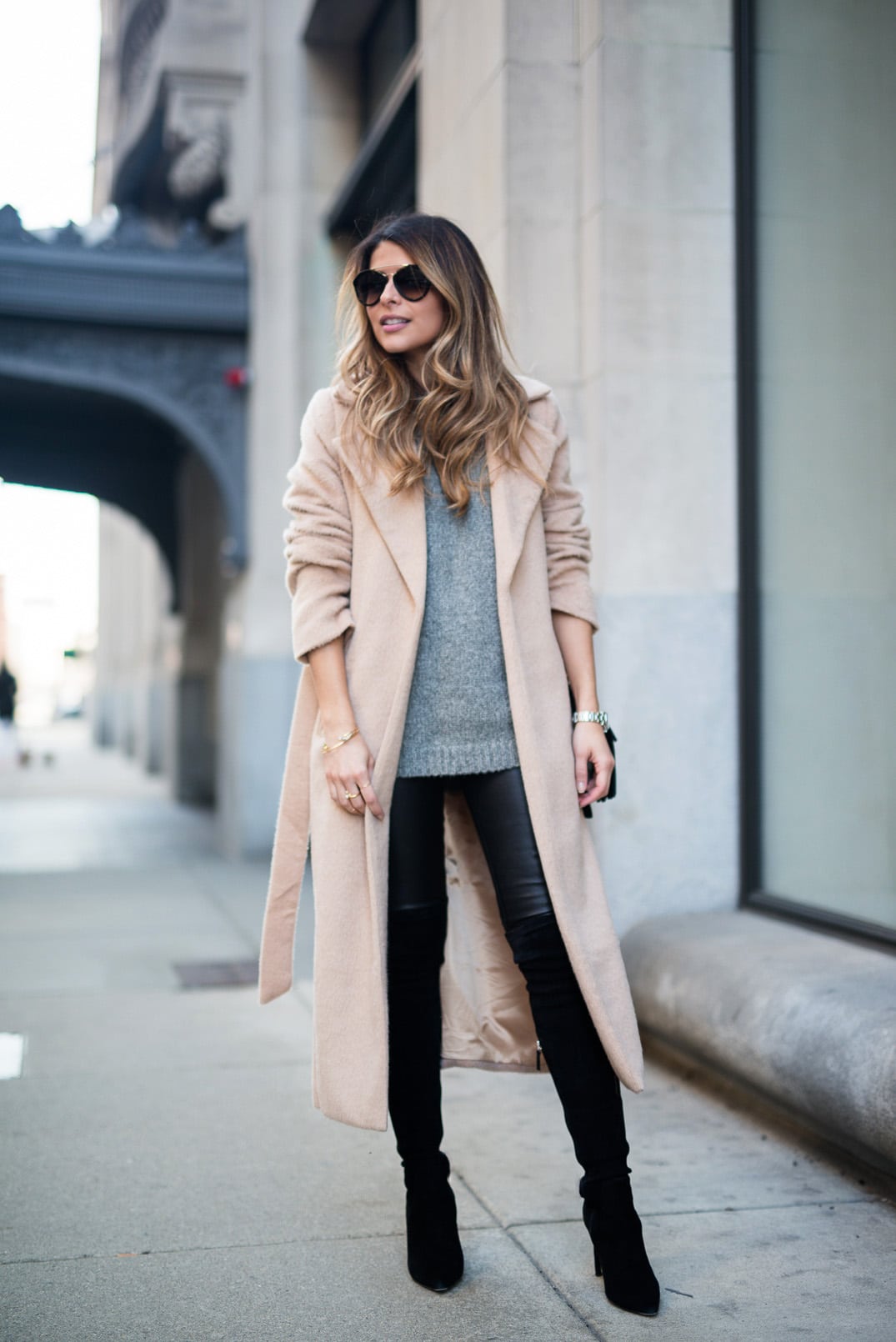 Pam Hetlinger wearing a Camel Coat, Gray Sweater, Leather Leggins, Over the Knee Boots, Winter Outfit Inspiration.
