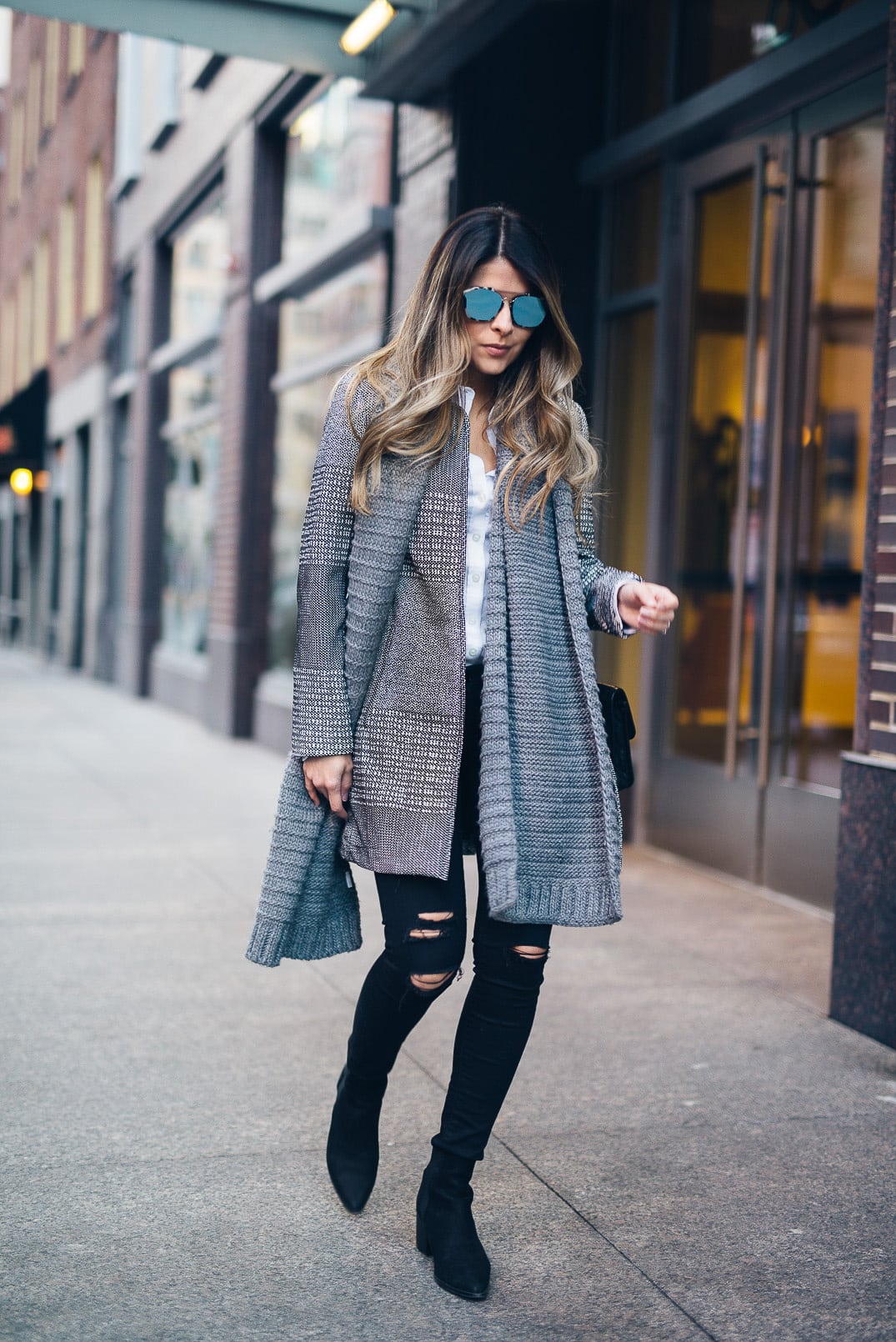 Pam Hetlinger wearing a Textured-weave Jacket, dstld ripped jeans, aldo low heel booties, dior abstract sunglasses, gray scarf, and chanel french riviera flap.