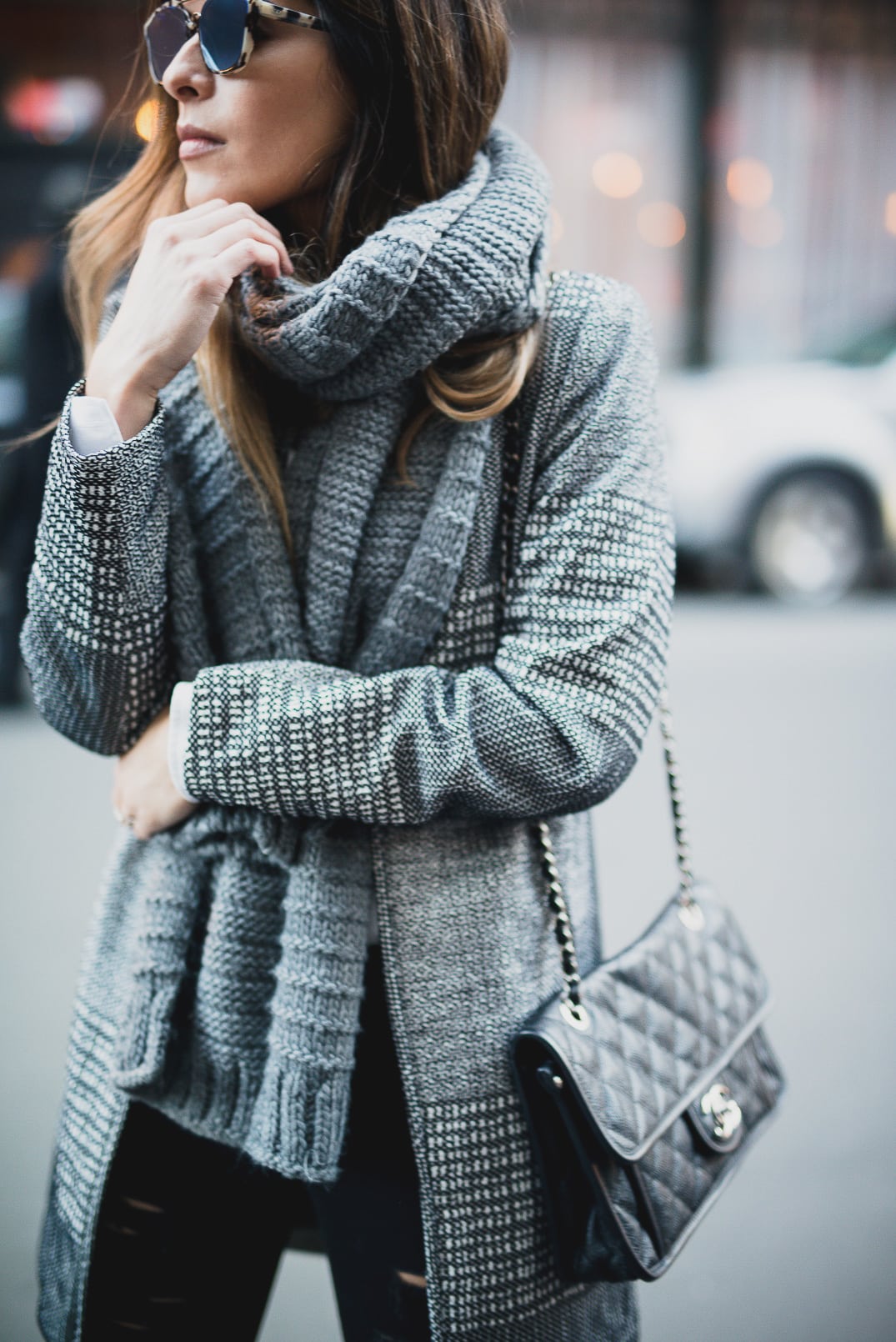 Pam Hetlinger wearing a Textured-weave Jacket, dstld ripped jeans, aldo low heel booties, dior abstract sunglasses, gray scarf, and chanel french riviera flap.