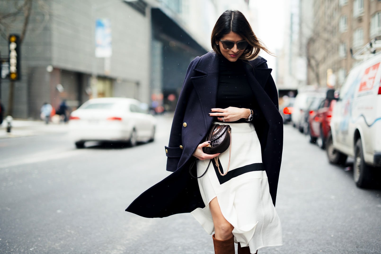 Pam Hetlinger, The Girl From Panama wearing a H&M navy coat, black turtleneck, finders keepers label lay it down skirt, barbara bui brown knee high boots, and salvatore ferragamo bag during New York Fashion Week.