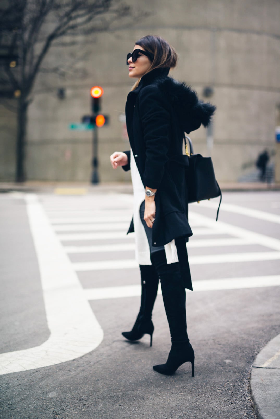 Pam Hetlinger, The Girl From Panama wearing Over-the-knee-boots, sleeveless tunic, gray denim, black coat, celine belt bag, and celine sunglasses