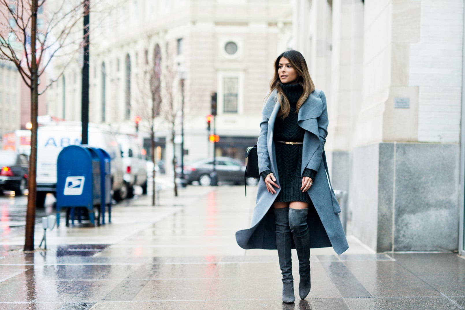 Pam Hetlinger, The Girl From Panama wearing a H&M grey sweater dress, stuart weitzman highland over-the-knee-boots, and a missguided grey belted coat.