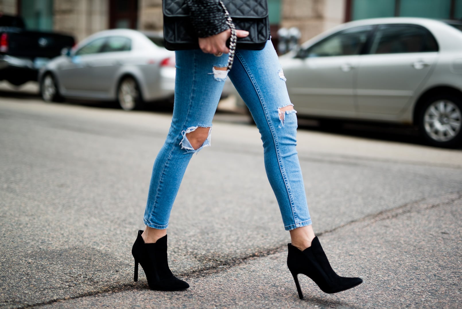 Pam Hetlinger, The Girl From Panama, wearing a Tweed Wrap Coat, Topshop ripped skinny jeans, black booties and a Chanel french riviera flap bag.