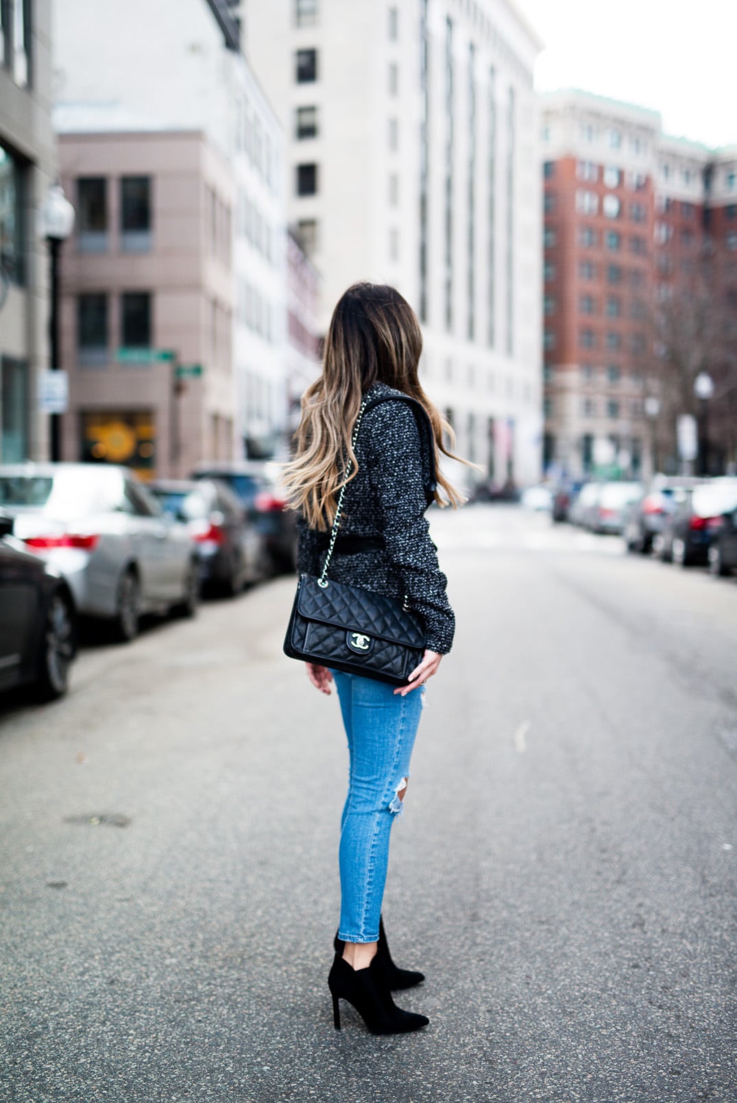 Pam Hetlinger, The Girl From Panama, wearing a Tweed Wrap Coat, Topshop ripped skinny jeans, black booties and a Chanel french riviera flap bag.