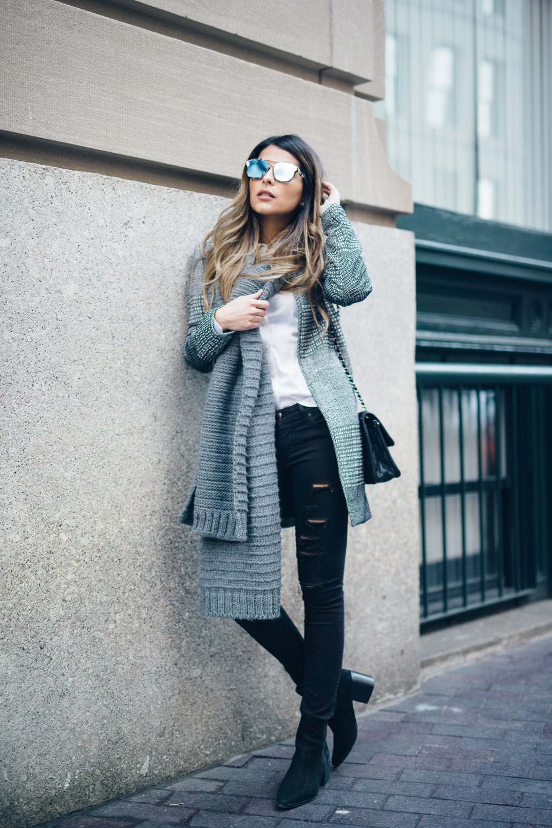 Pam Hetlinger wearing a Textured-weave Jacket, dstld ripped jeans, aldo low heel booties, dior abstract sunglasses, gray scarf, and chanel french riviera flap.