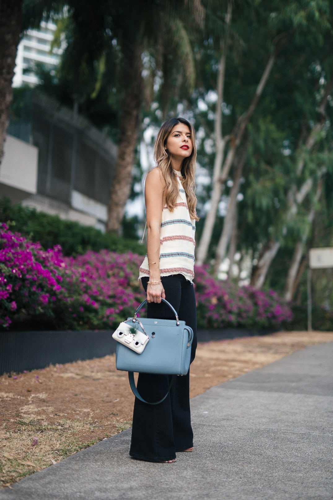 Pam Hetlinger, The Girl From Panama wearing an H&M Halter top, Mango Flare Jeans, Fendi DotCom bag, M.A.C Cosmetics velvetease lip pencil, and Fendi micro bag.