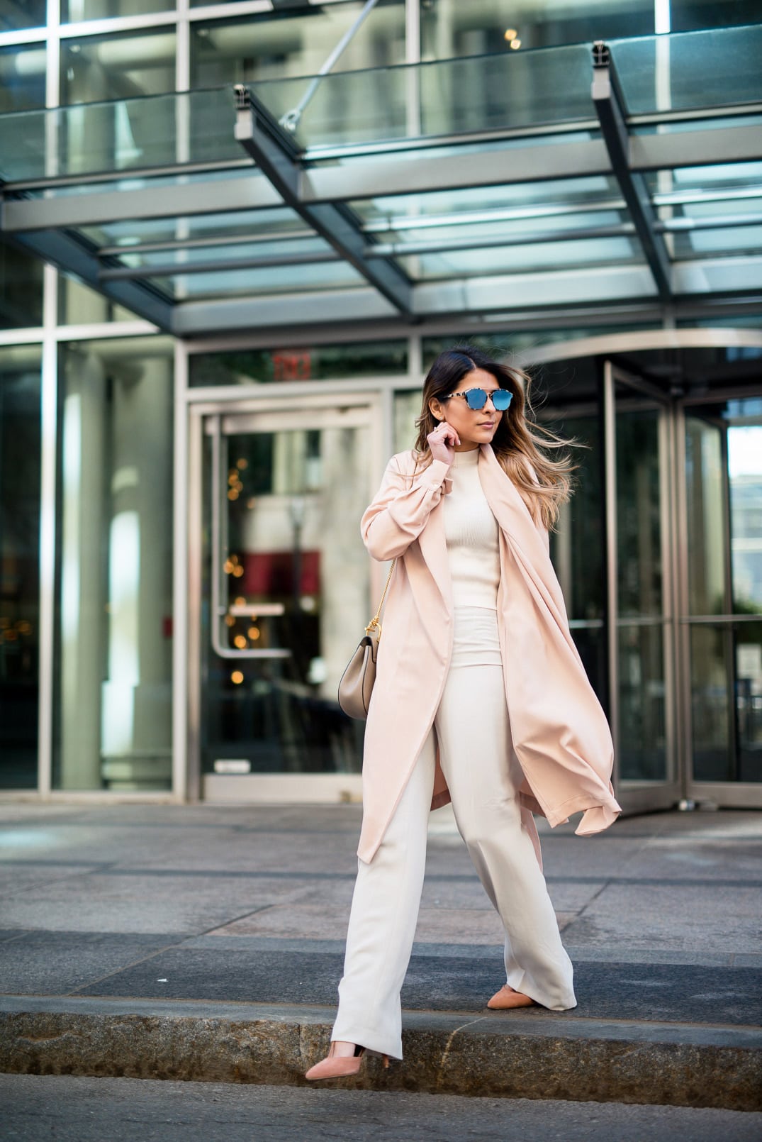 Pam Hetlinger wearing a Mango blush jacket, reiss lace up pumps, h&m high waisted white pants, h&m white crop top sweater, dior sunglasses, and chloe drew bag.