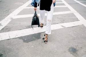 Pam Hetlinger wearing a denim jacket, Aquazzura Poppy Delevingne Hero lace-up suede and leather sandals, cropped white skinny jeans, asos black sweater, and celine belt bag