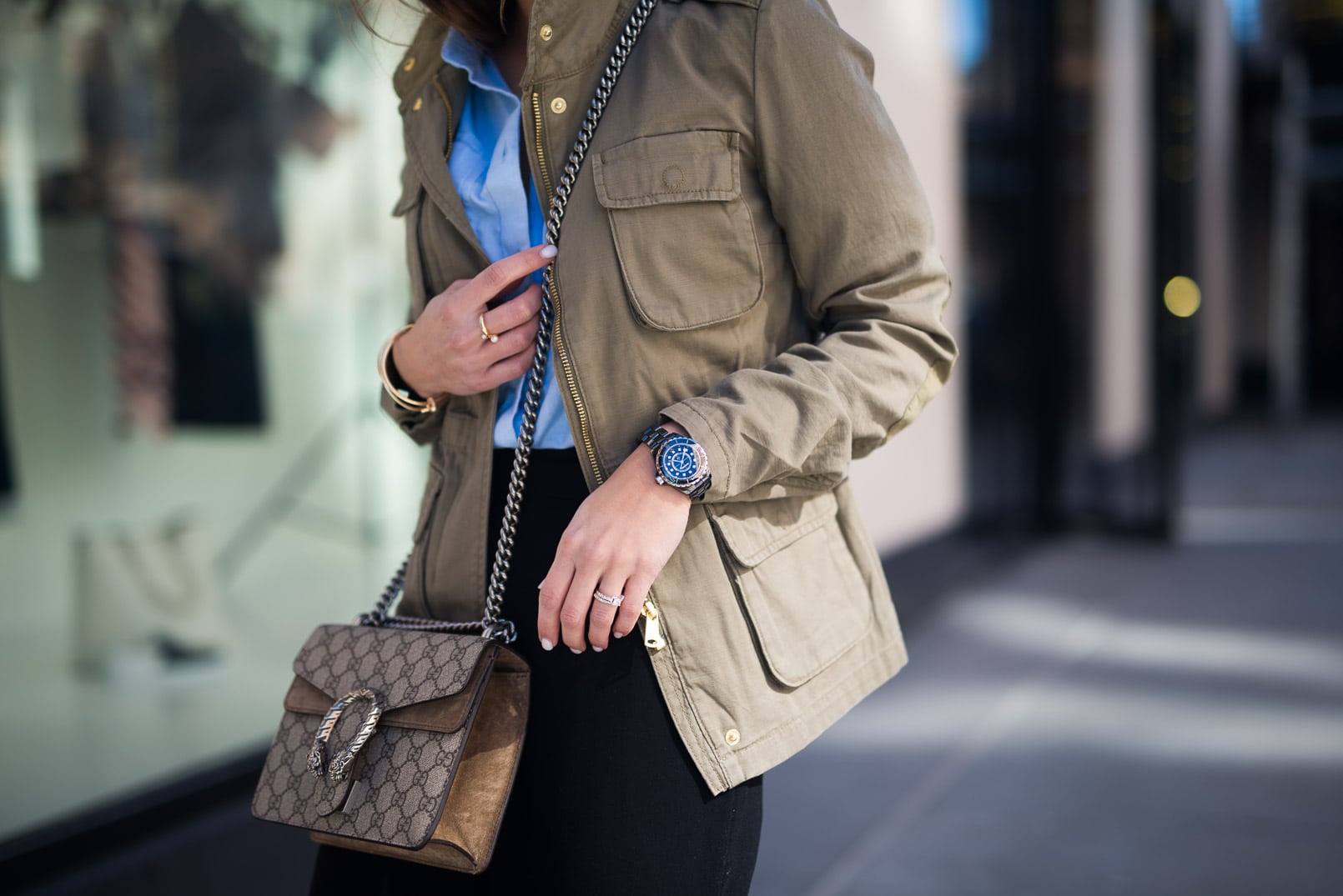 Pam Hetlinger, The Girl From Panama wearing an H&M cargo jacket, topshop blue buttom up shirt, black culottes, gucci bag, and M.gemi black pumps.