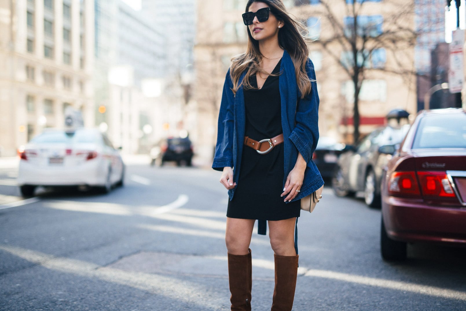 Pam Hetlinger wearing a nordstrom little black dress, barbara bui knee high brown boots, Neon Rose Belted Denim Jacket, Chloe Georgia Bag, Brown Belt, and Celine Sunglasses