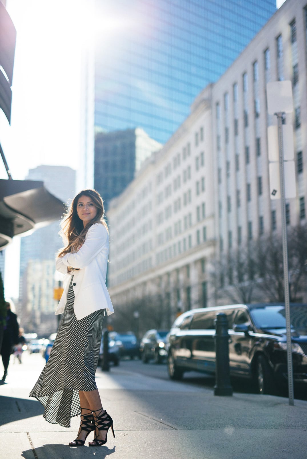 Pam Hetlinger, The Girl From Panama wearing Aquazzura Beverly Hills Sandals, C-MEO all lights skirt, Express Barcelona Cami, Club Monaco White Blazer, Celine Belt Bag, Lace Bralette