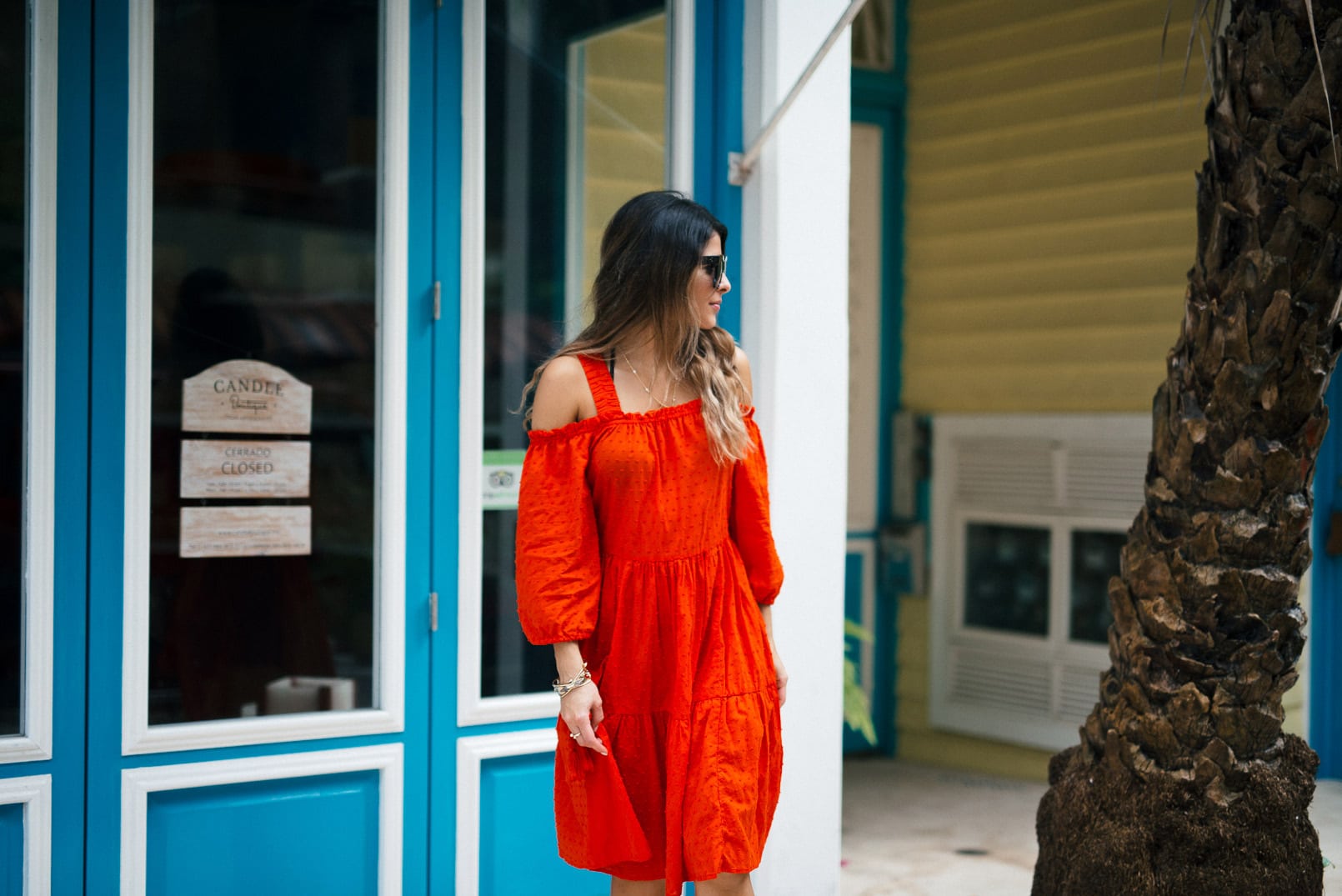 Pam Hetlinger wearing a m.gemi albero sandals, h&m red dress, celine sunglasses, and a mar y sol capri tote.