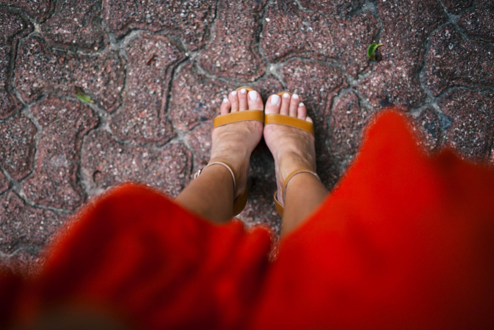 Pam Hetlinger wearing a m.gemi albero sandals, h&m red dress, celine sunglasses, and a mar y sol capri tote.