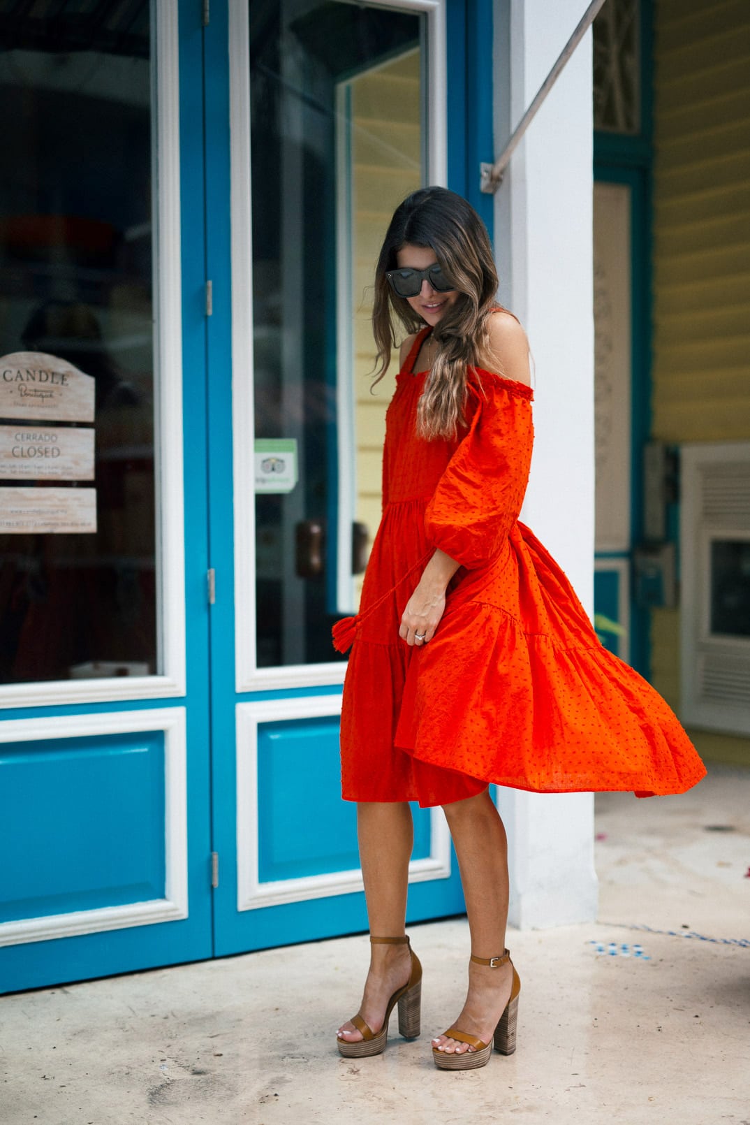 Pam Hetlinger wearing a m.gemi albero sandals, h&m red dress, celine sunglasses, and a mar y sol capri tote.