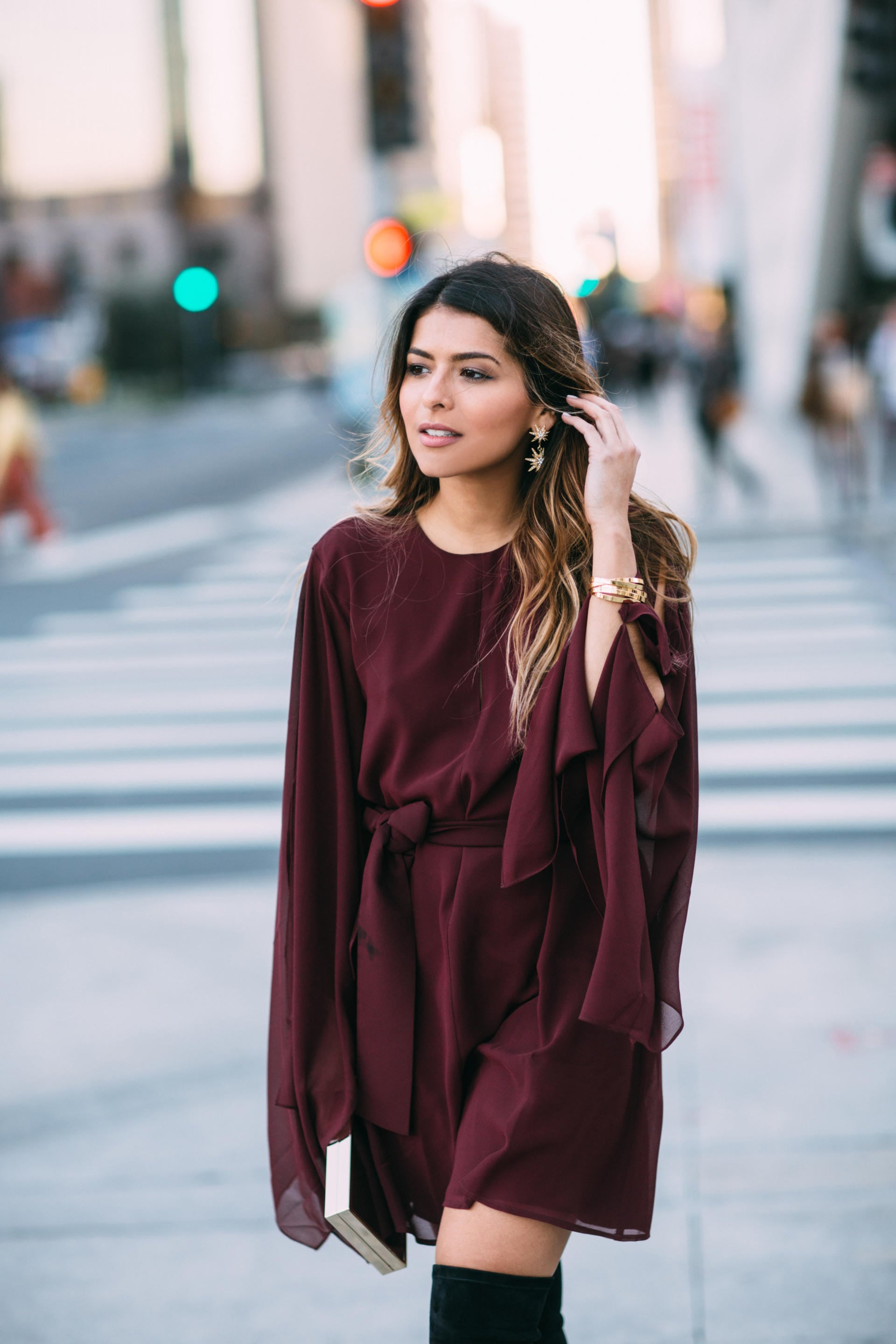 Keepsake step back burgundy dress, star earrings, black over-knee-boots, holiday party look | The Girl From Panama