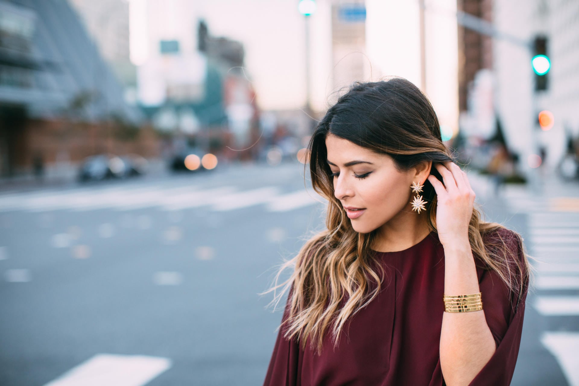 Keepsake step back burgundy dress, star earrings, black over-knee-boots, holiday party look | The Girl From Panama