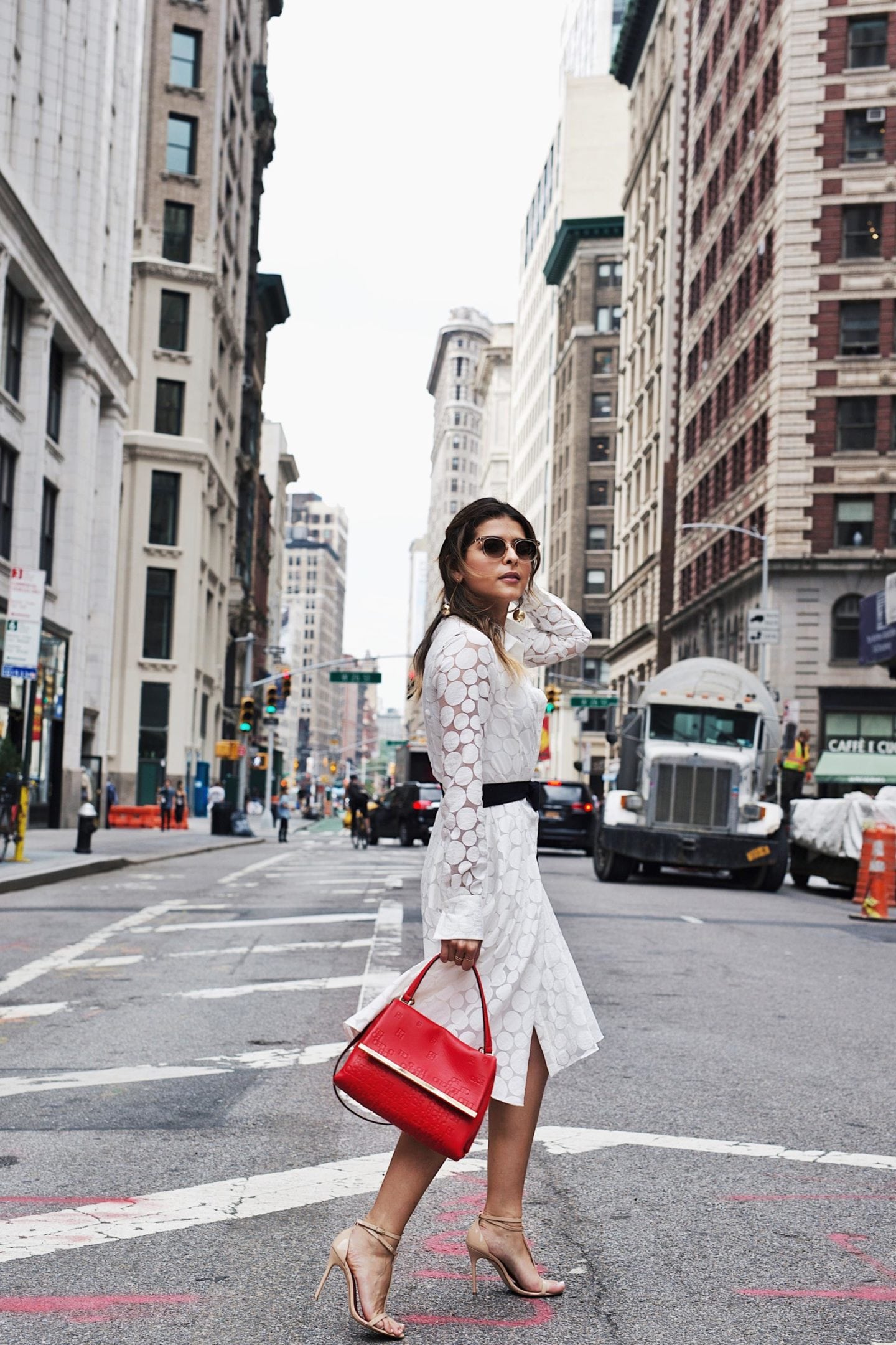 White Lace Dress, Nude Heels, Red Carolina Herrera Handbag in NYC