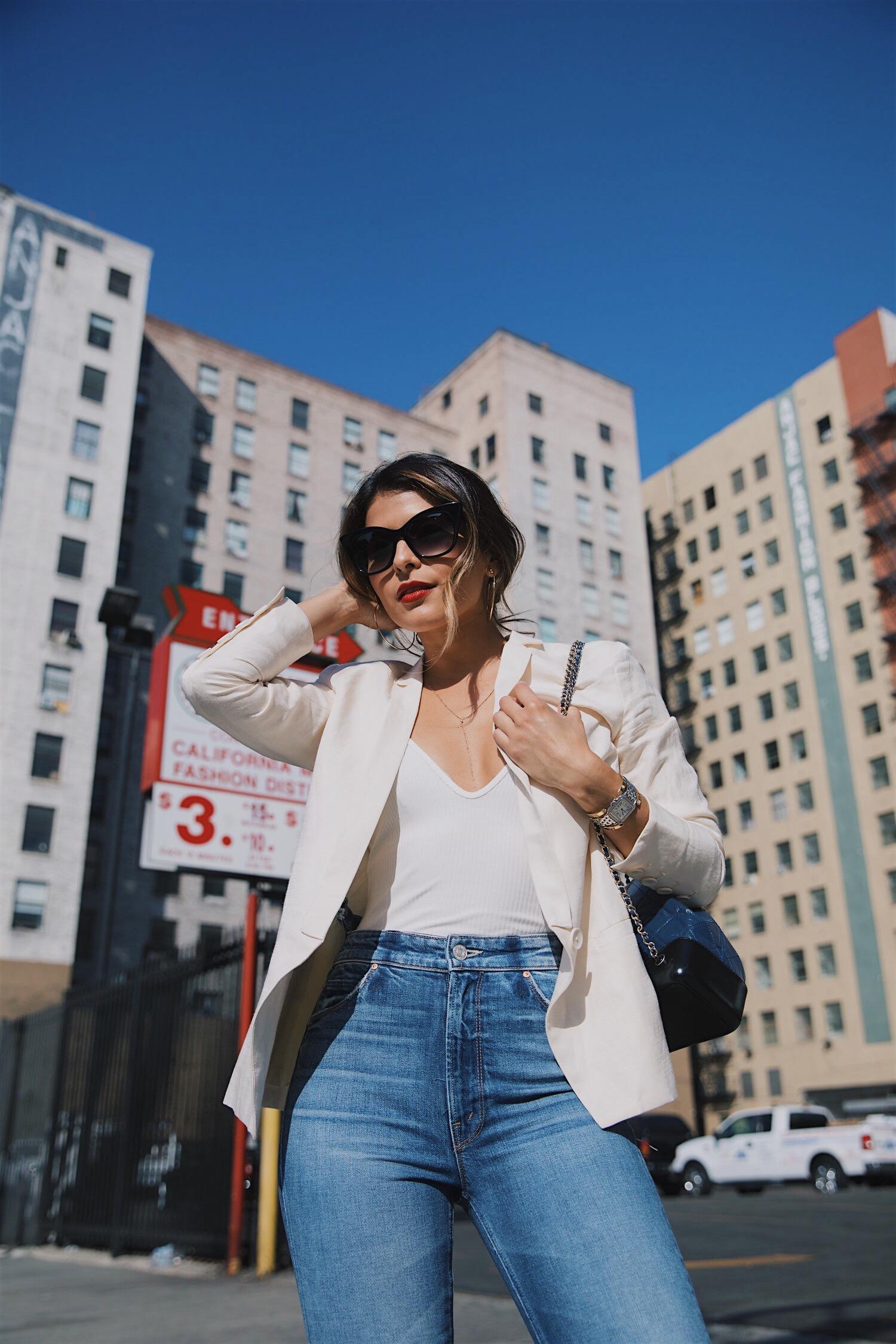 Pam Hetlinger wearing a mother denim jeans with a capulet bodysuit, chanel gabrielle bag and armani lip maestro lipstick