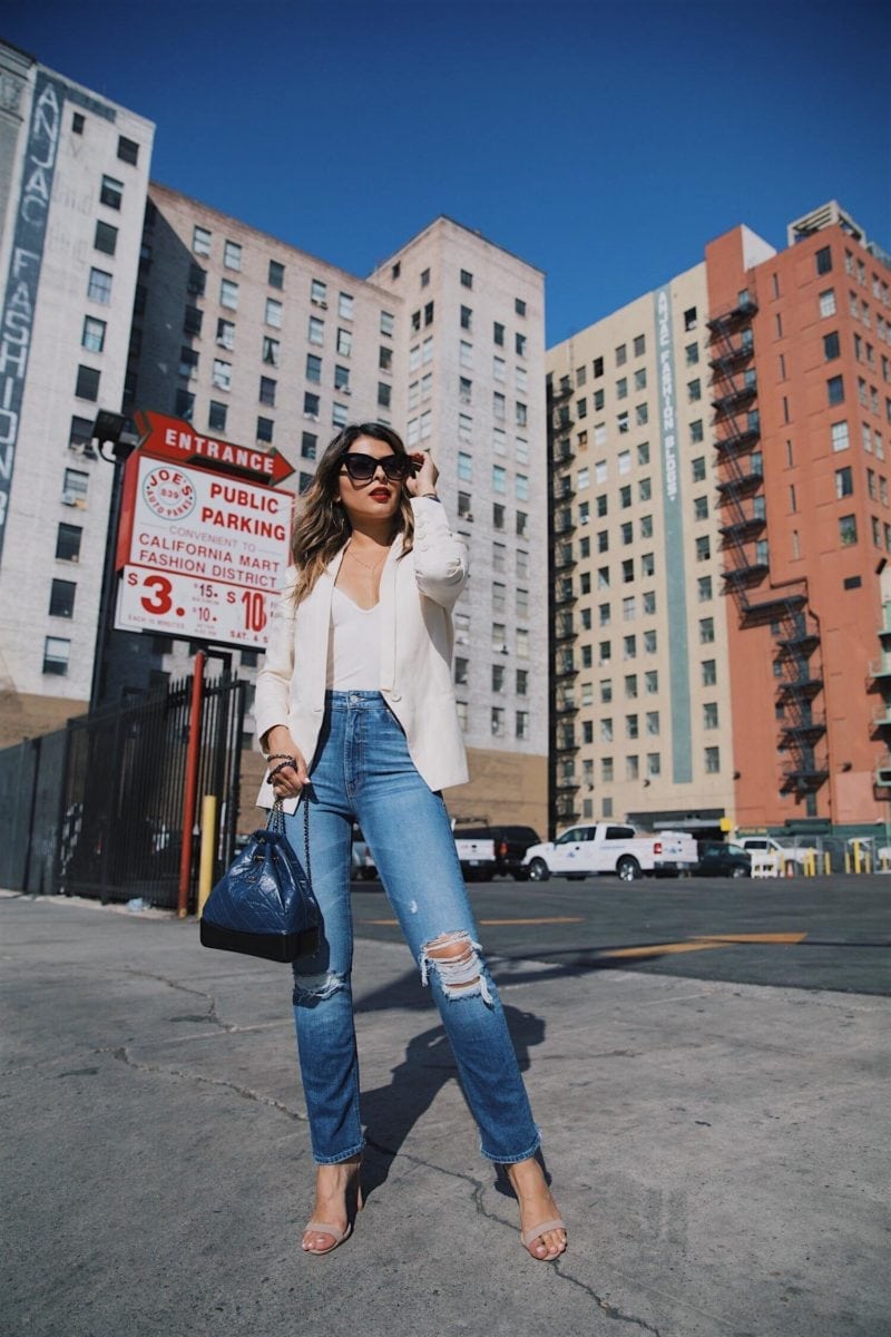Pam Hetlinger wearing a mother denim jeans with a capulet bodysuit, chanel gabrielle bag and armani lip maestro lipstick
