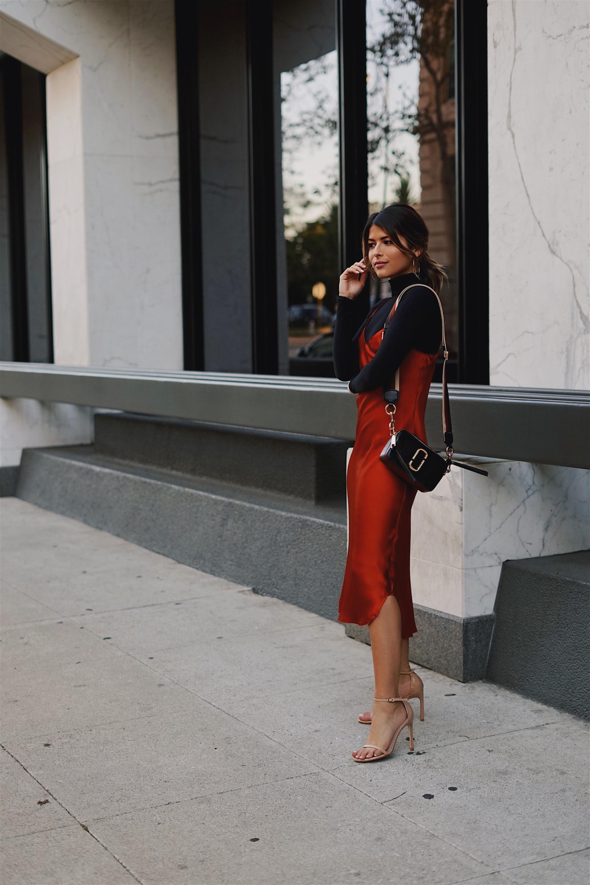 Pam Hetlinger wearing a silk slip dress and a black turtleneck