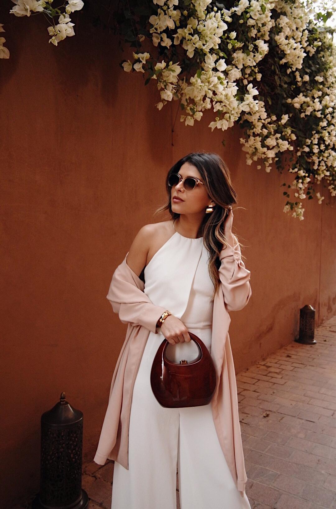 Pam Hetlinger wearing a white jumpsuit in Marrakech Morocco