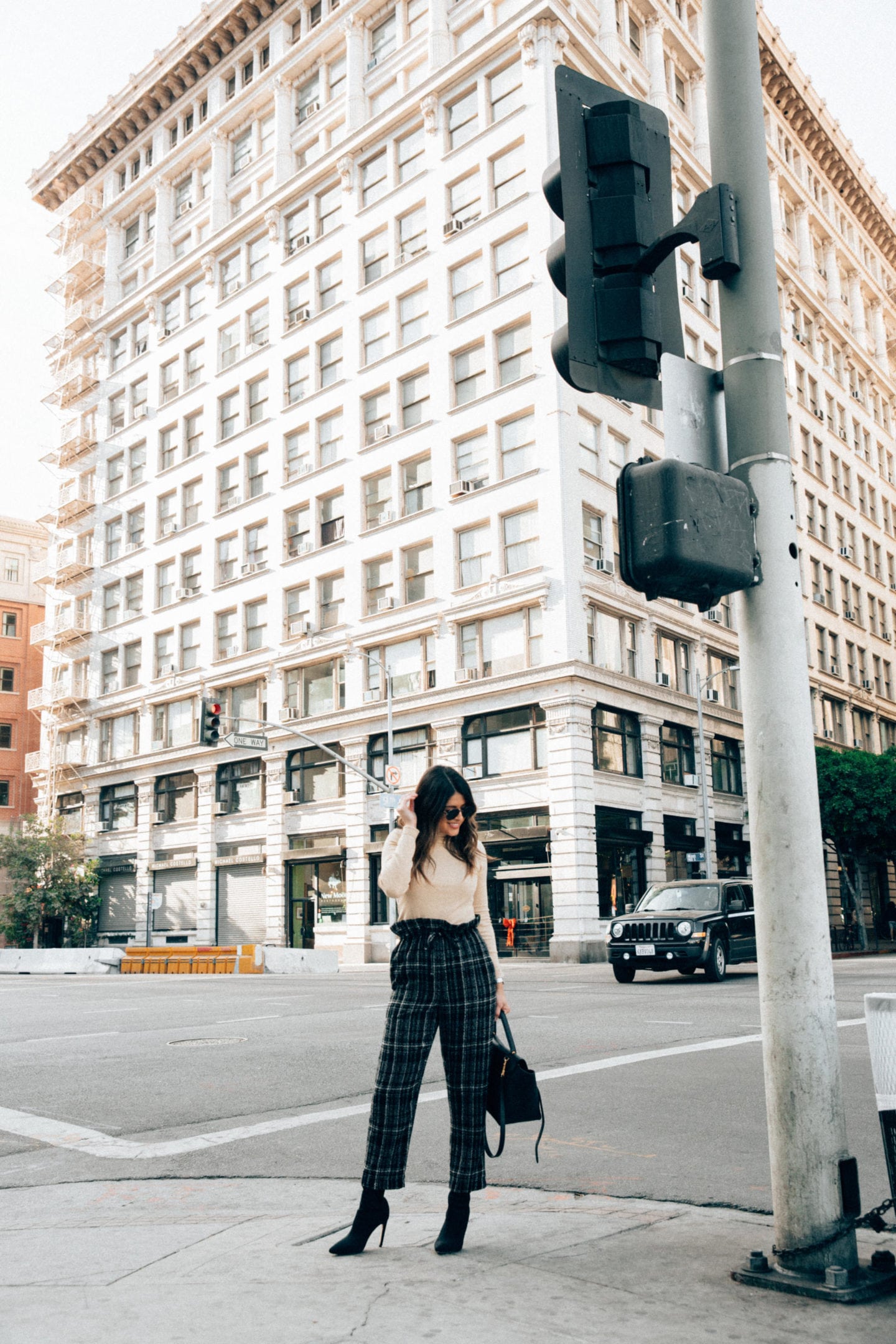 How to Set Realistic New Year's Resolutions - Green Plaid Trousers with Tan Turtleneck Sweater, Green Handbag, and Black Boots | Thegirlfrompanama.com