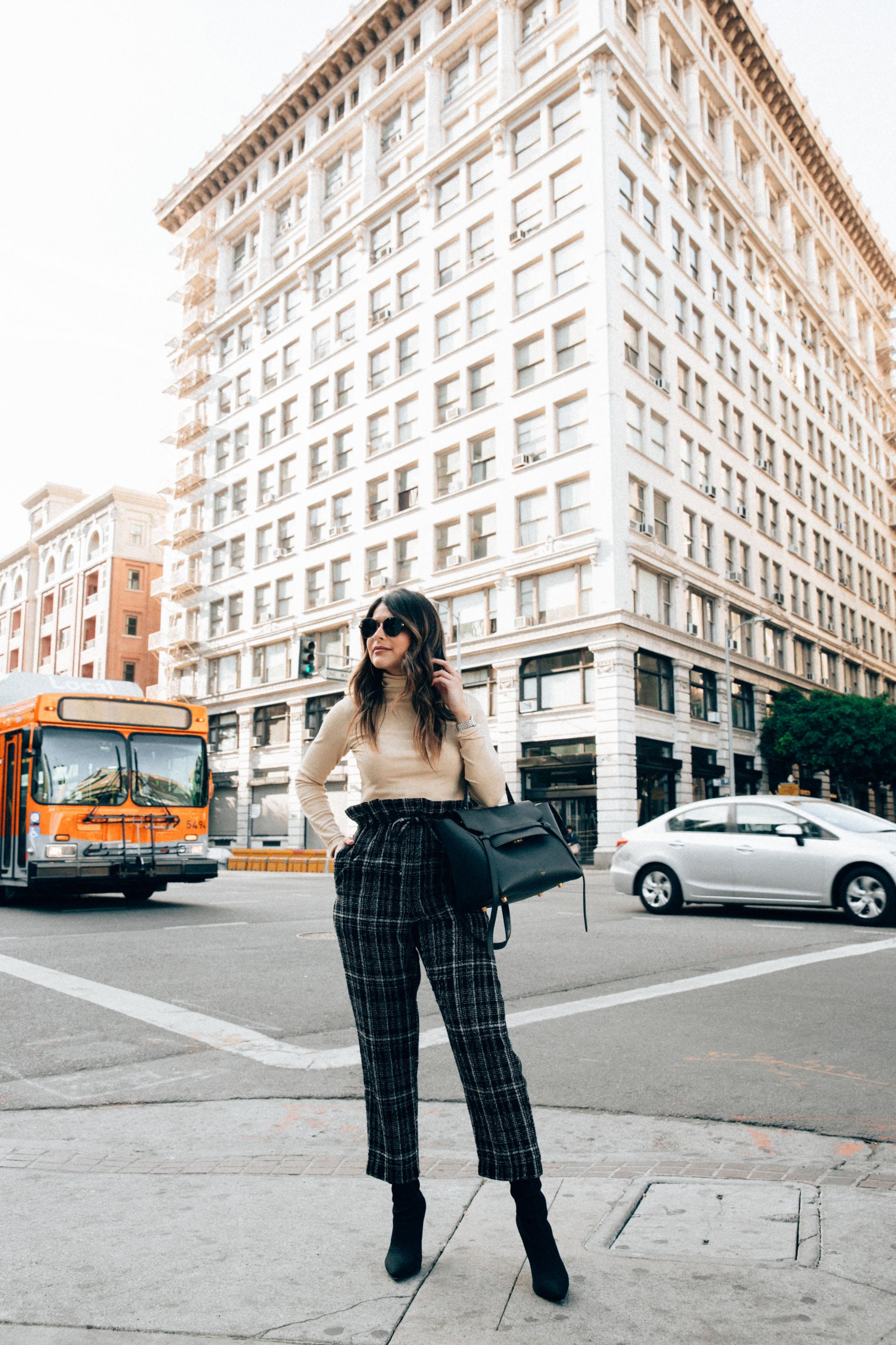 How to Set Realistic New Year's Resolutions - Green Plaid Trousers with Tan Turtleneck Sweater, Green Handbag, and Black Boots | Thegirlfrompanama.com