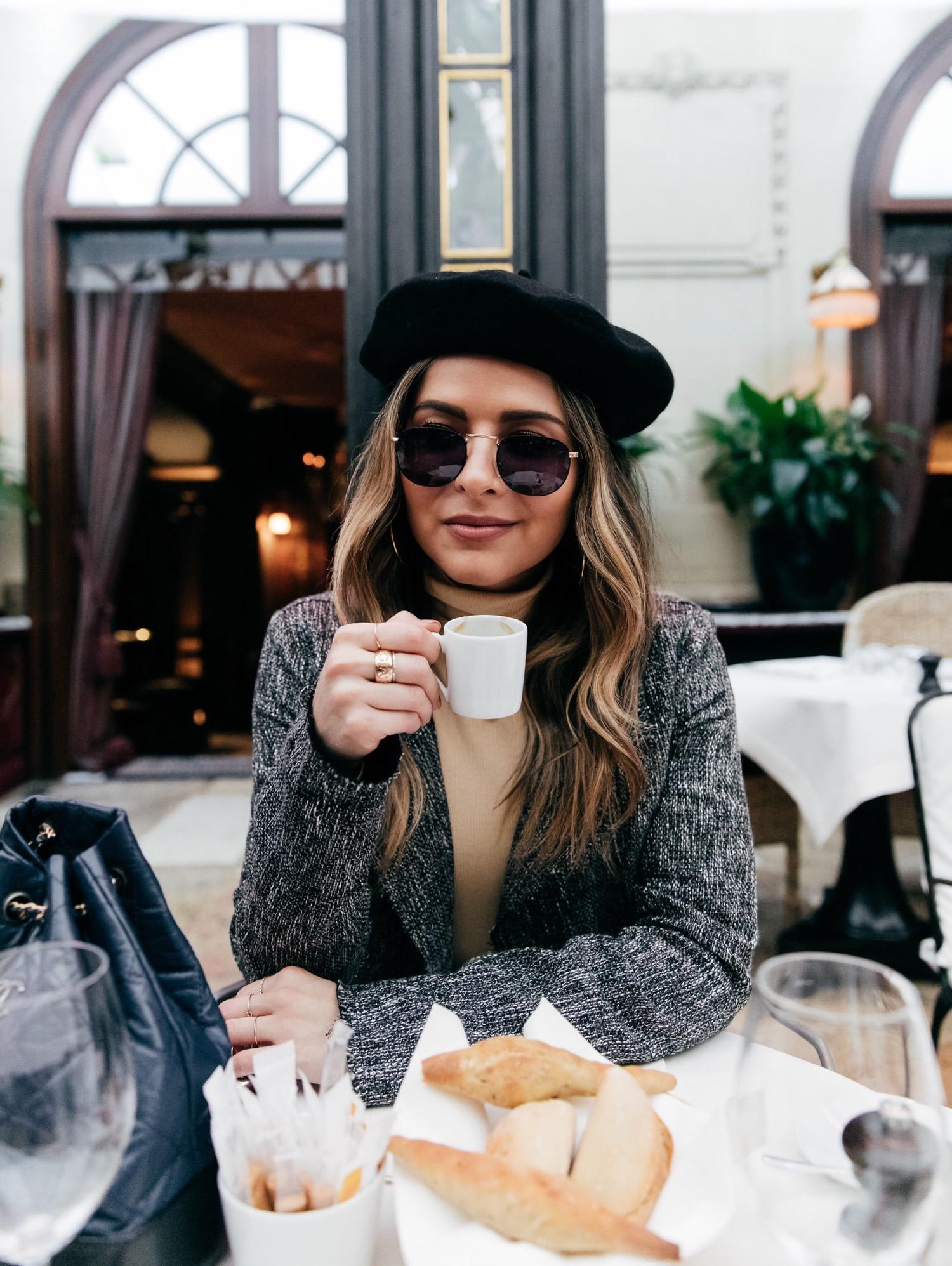 TheGirlFromPanama.com | Paris Travel Guide in the Winter | Pam Hetlinger at Hotel Costes wearing a beret hat and a grey jacket in Paris France