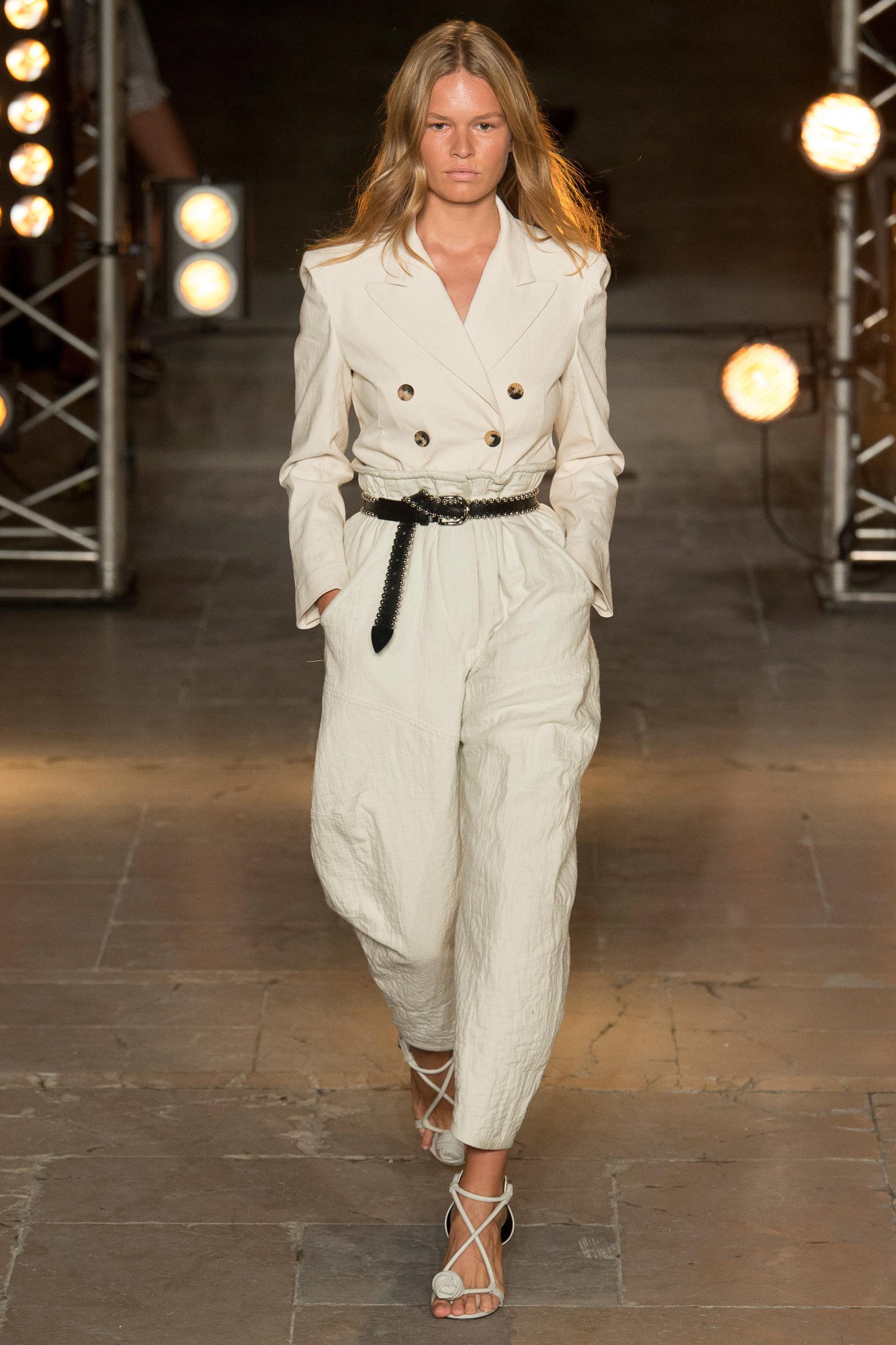 White pant suit cinch with a belt at the waist