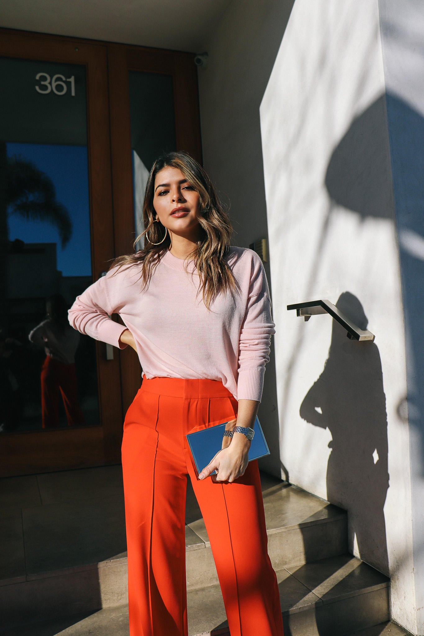 Pink sweater and red pants