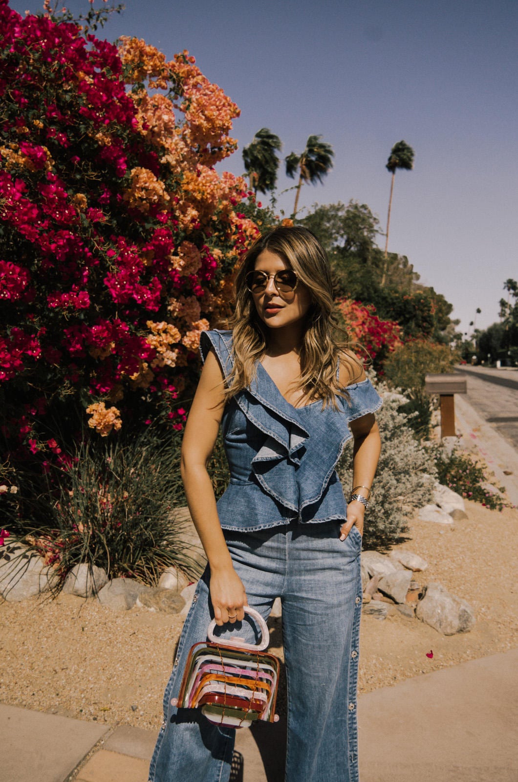 Pam Hetlinger wearing Dark Denim Jumpsuit and Cult Gaia Bag at Coachella - Fesitval Outfits Round Up | TheGirlFromPanama.com