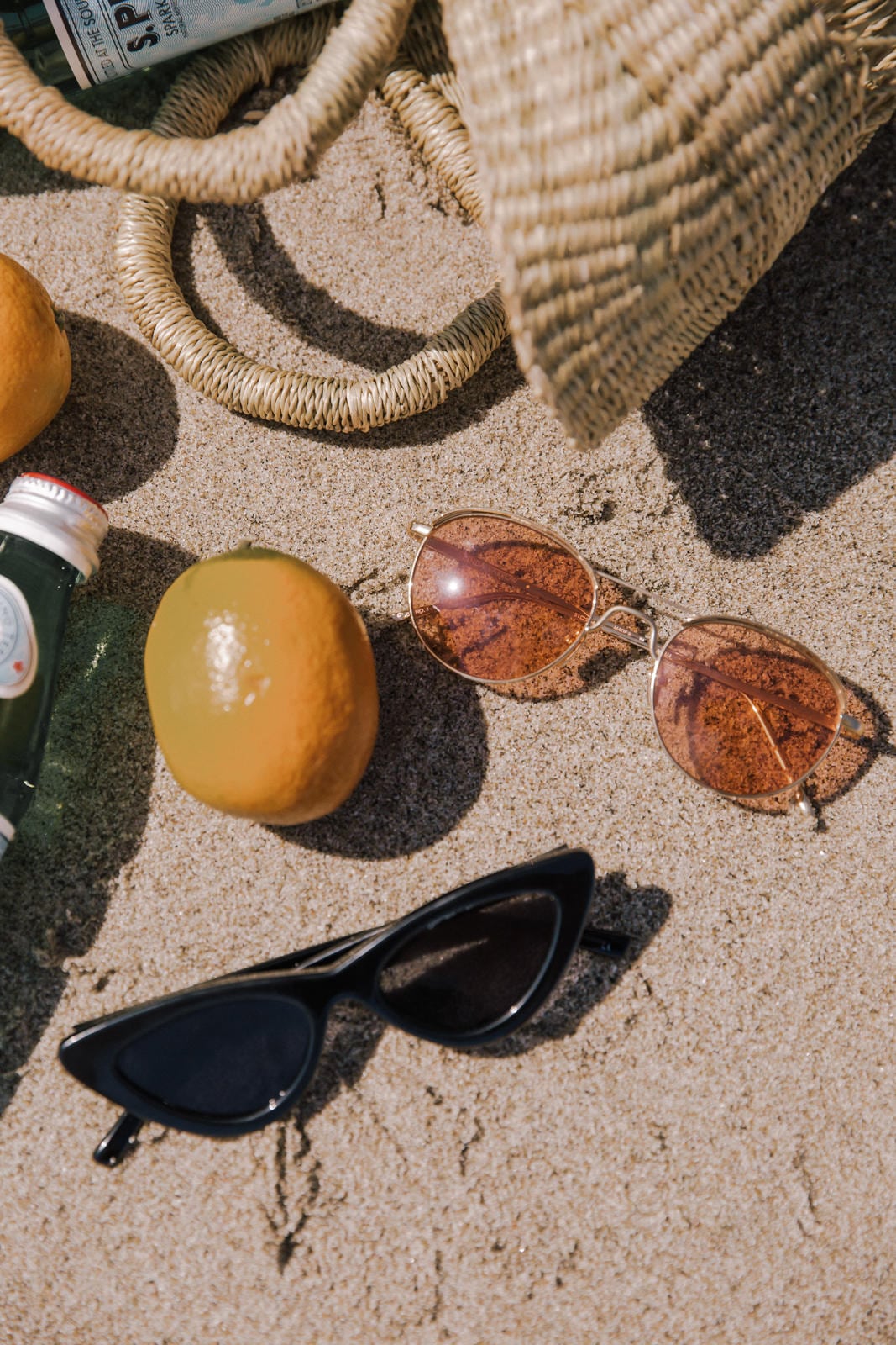 Sunglasses I Can't Stop Wearing This Summer by Pam Hetlinger | Beach Flatlay, sunglasses trends
