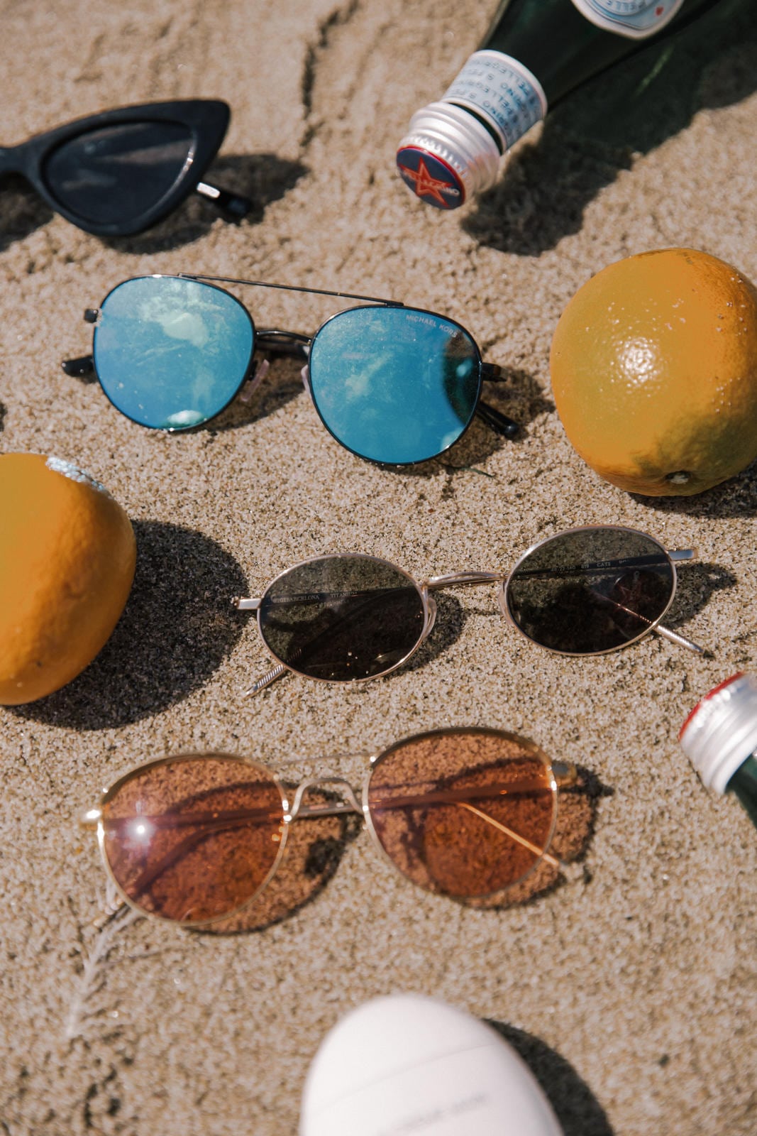 Sunglasses I Can't Stop Wearing This Summer by Pam Hetlinger | Beach Flatlay, sunglasses trends