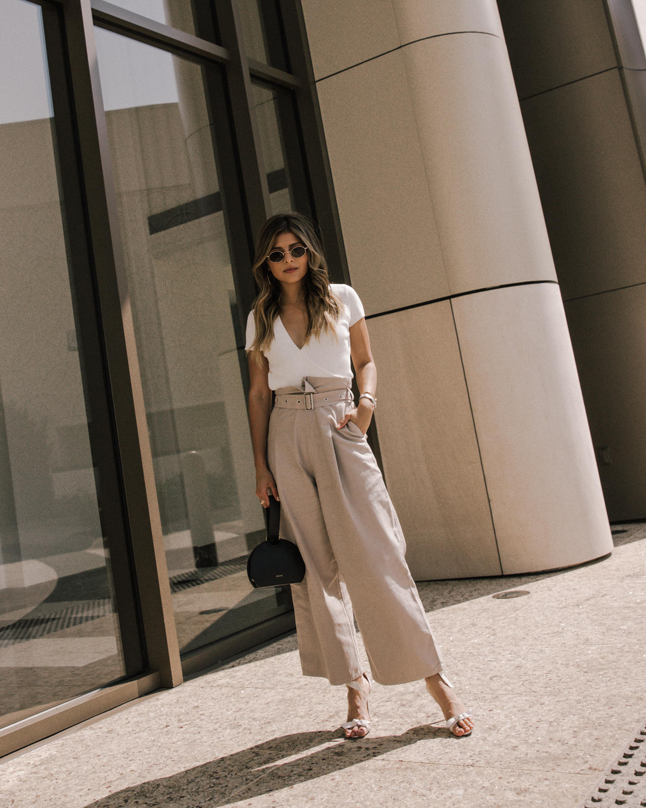 Classic White Shirts To Live In All Year Long by Pam Hetlinger, white shirt styling tips | TheGirlFromPanama.com | Wide leg trousers, belted culottes, white wrap top, alexandra birman sandals