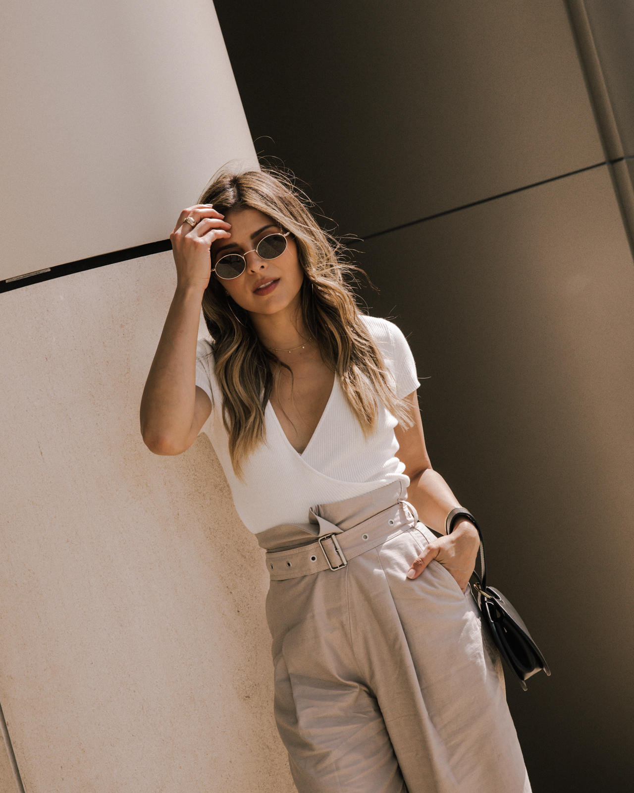 Classic White Shirts To Live In All Year Long by Pam Hetlinger, white shirt styling tips | TheGirlFromPanama.com | Wide leg trousers, belted culottes, white wrap top, alexandra birman sandals