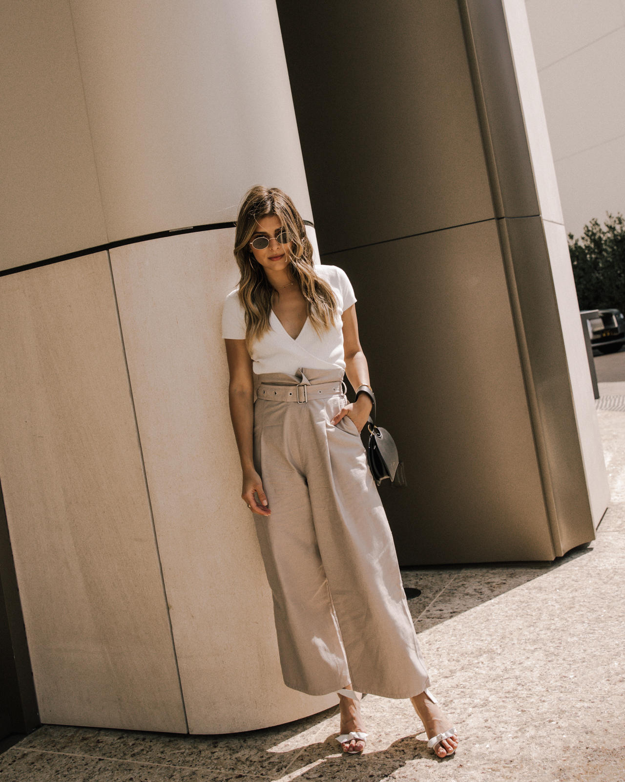 Classic White Shirts To Live In All Year Long by Pam Hetlinger, white shirt styling tips | TheGirlFromPanama.com | Wide leg trousers, belted culottes, white wrap top, alexandra birman sandals