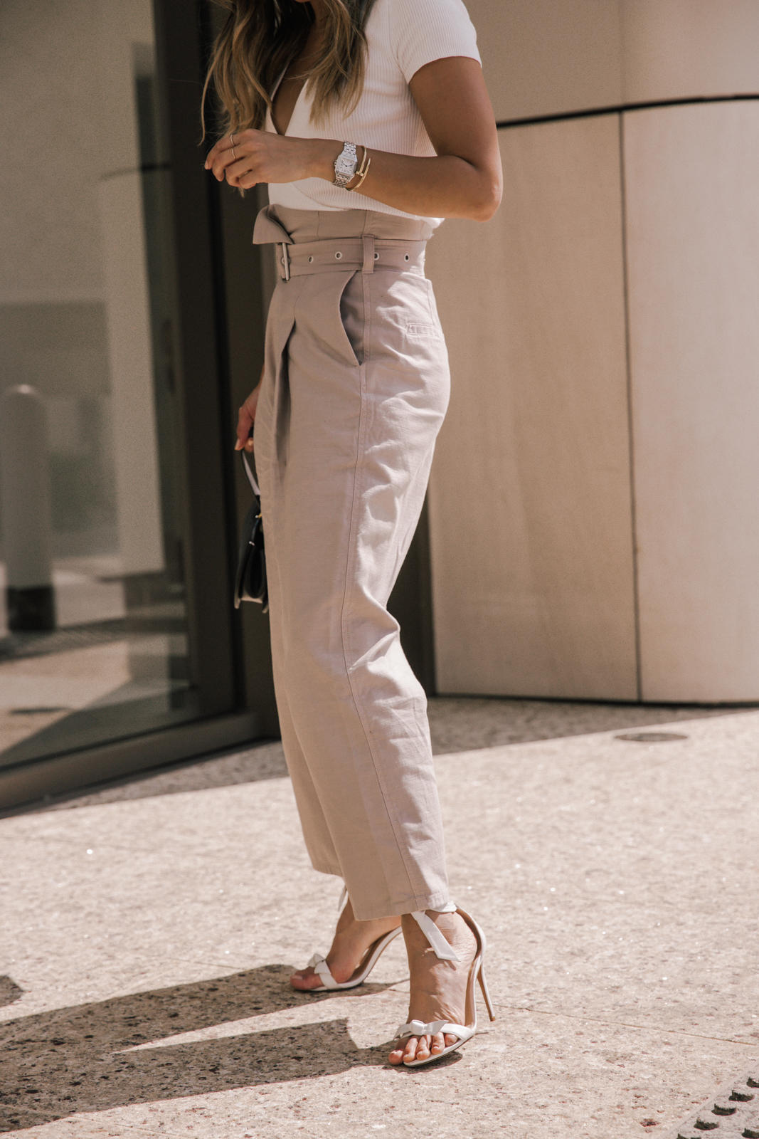 Classic White Shirts To Live In All Year Long by Pam Hetlinger, white shirt styling tips | TheGirlFromPanama.com | Wide leg trousers, belted culottes, white wrap top, alexandra birman sandals